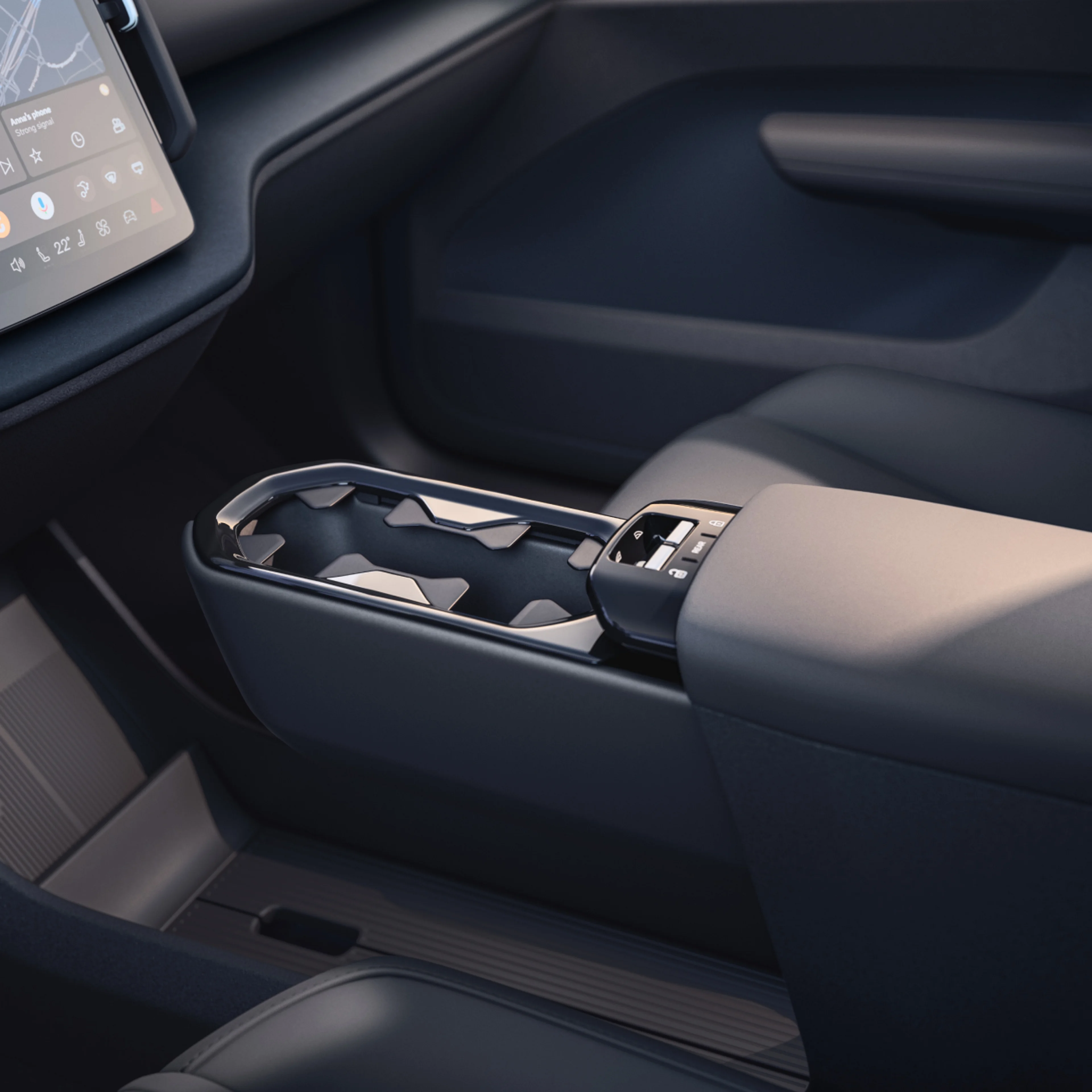 Close-up of the EX30's innovative multi-storage area and cupholder.