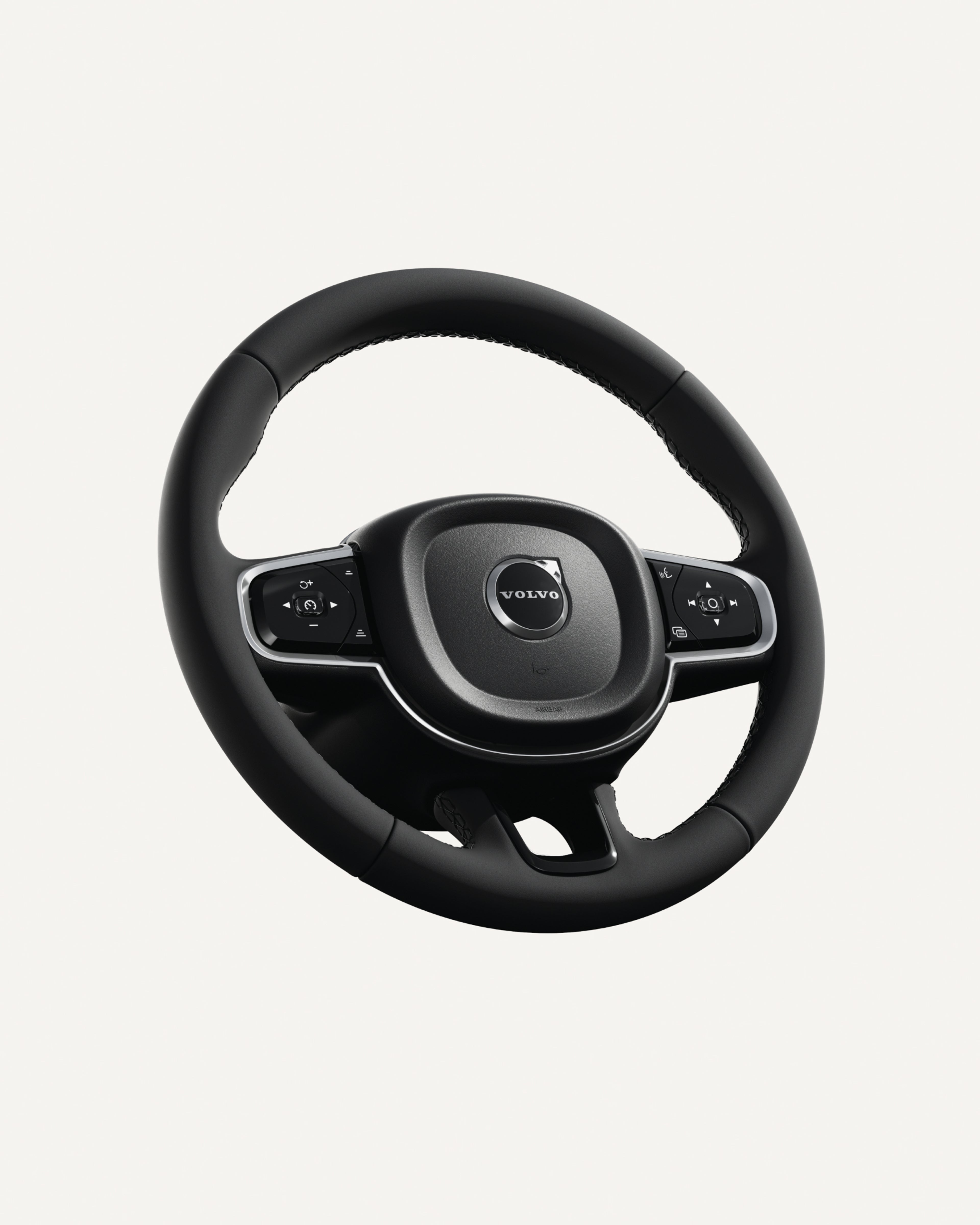 Close-up of the Volvo XC60 steering wheel, featuring integrated controls.