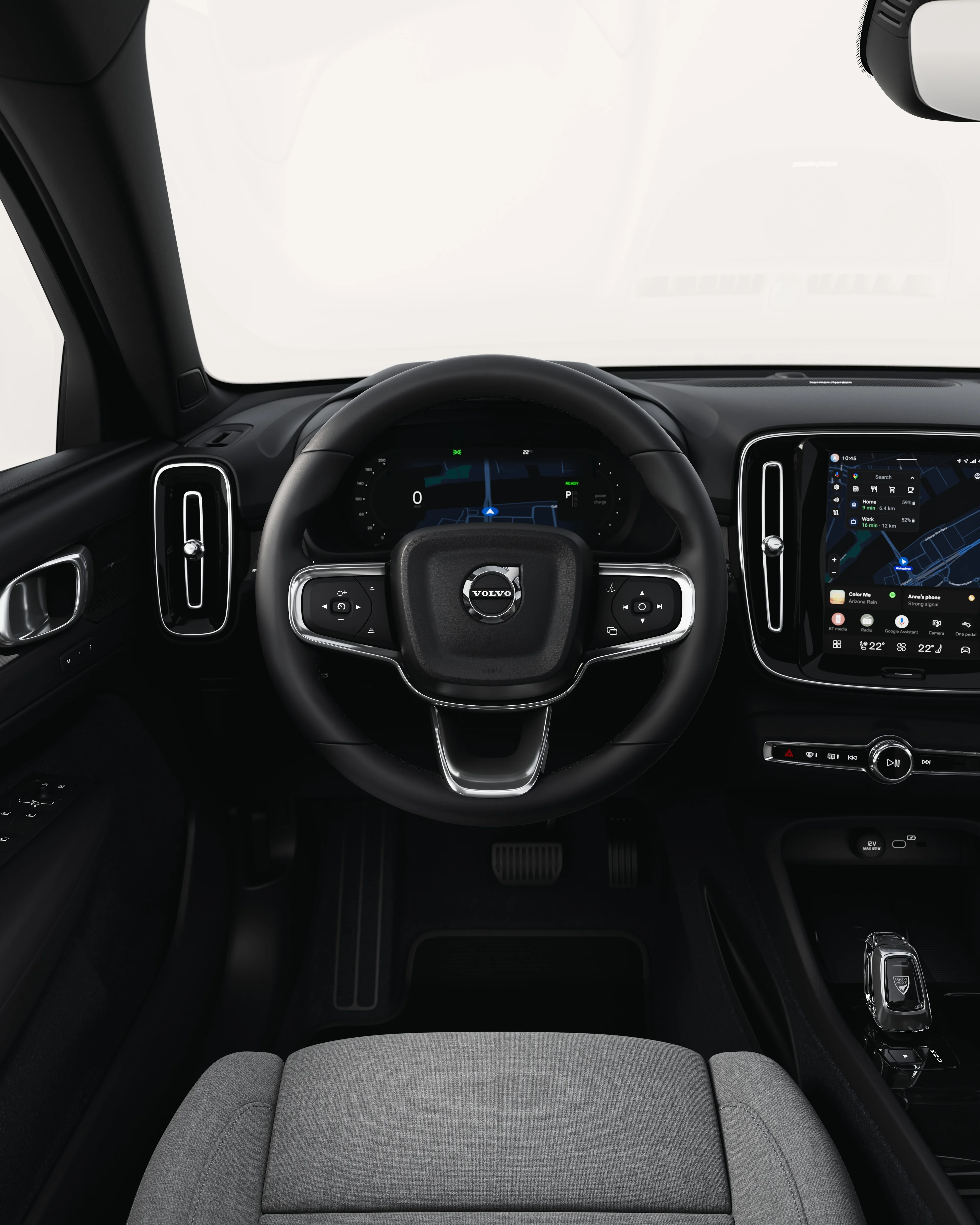 Central touchscreen displaying navigation and media controls in the Volvo EC40.