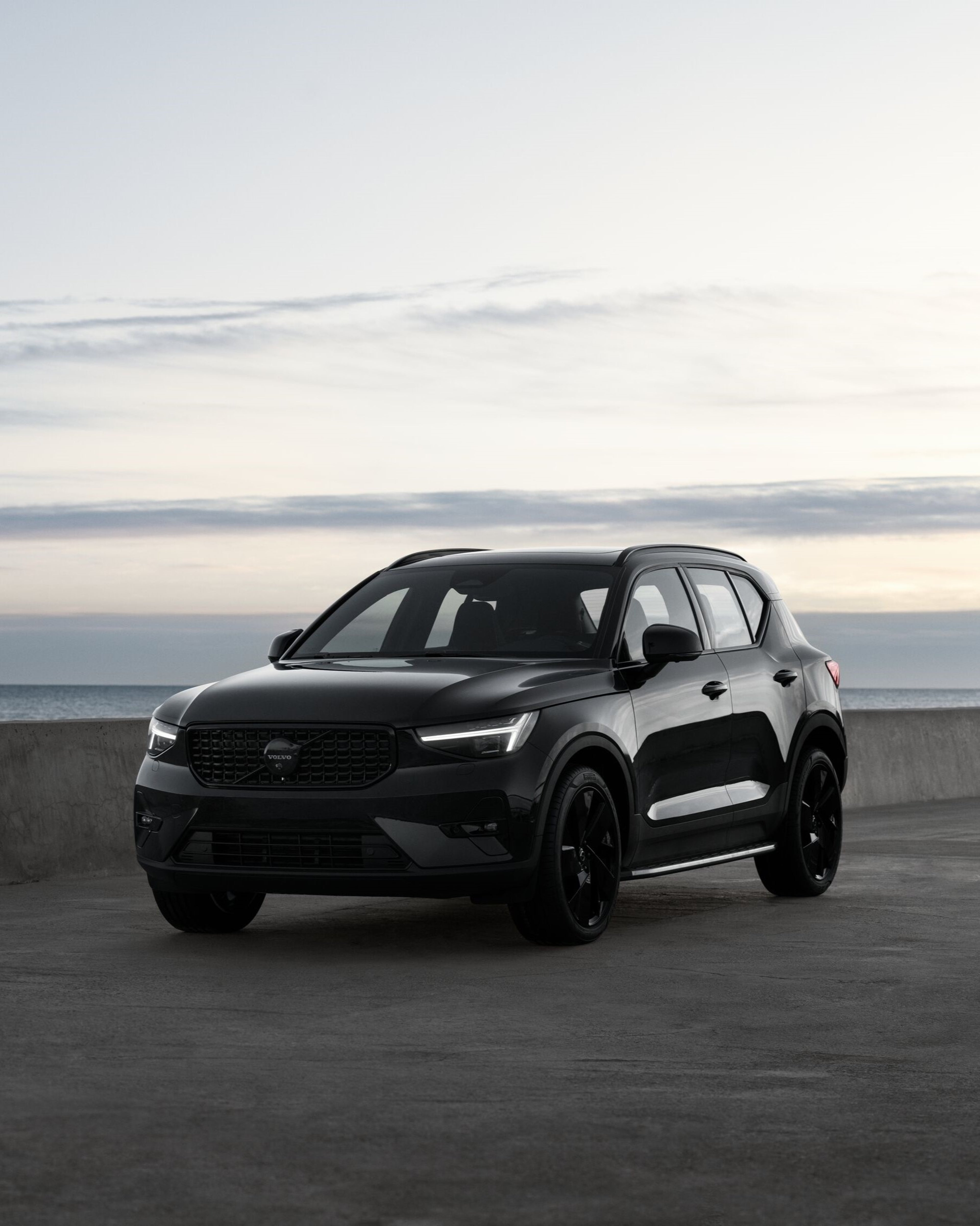 Front angle of Volvo XC40 Black Edition in front of water