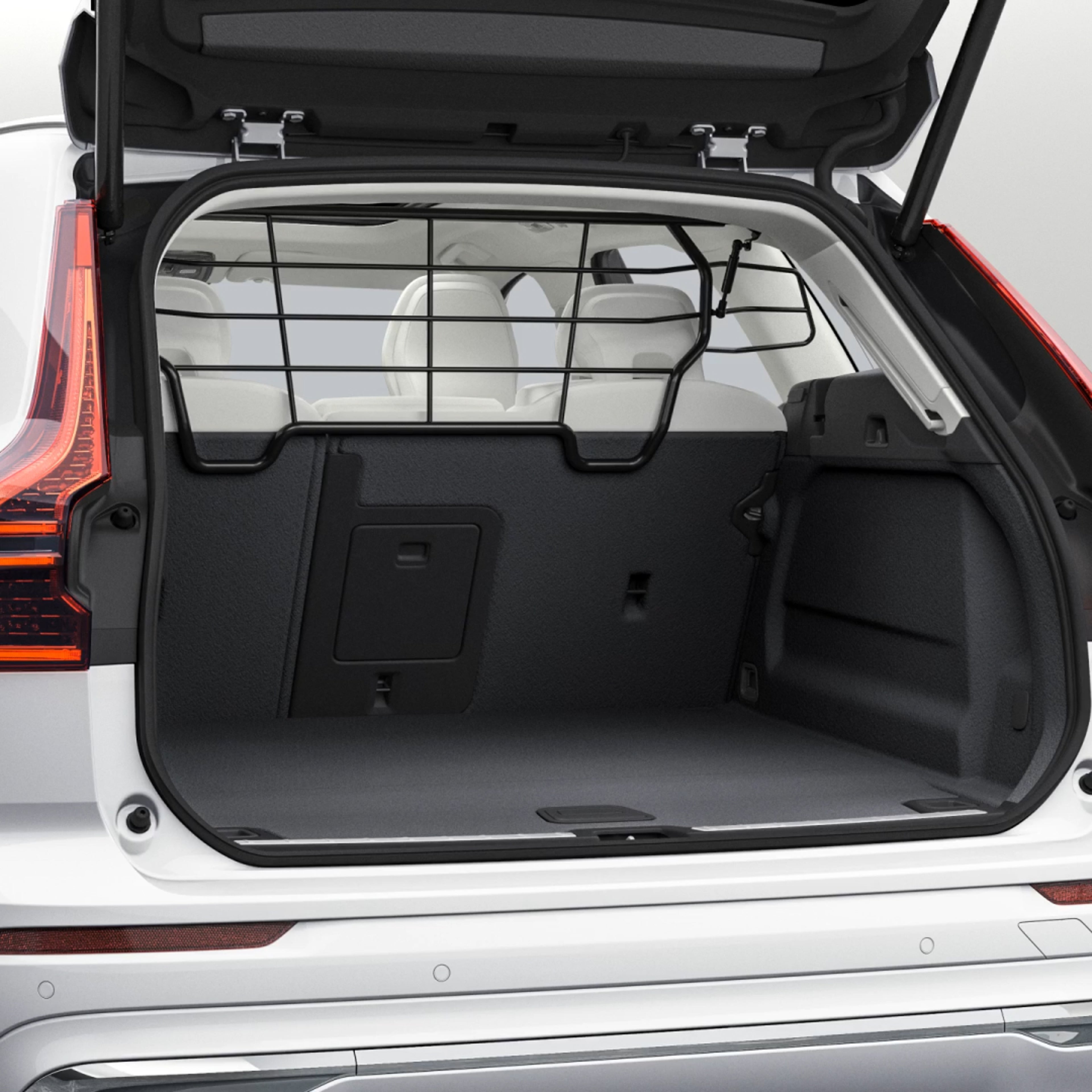 An open boot showing the hidden storage/cargo divider inside a Volvo XC60 SUV.