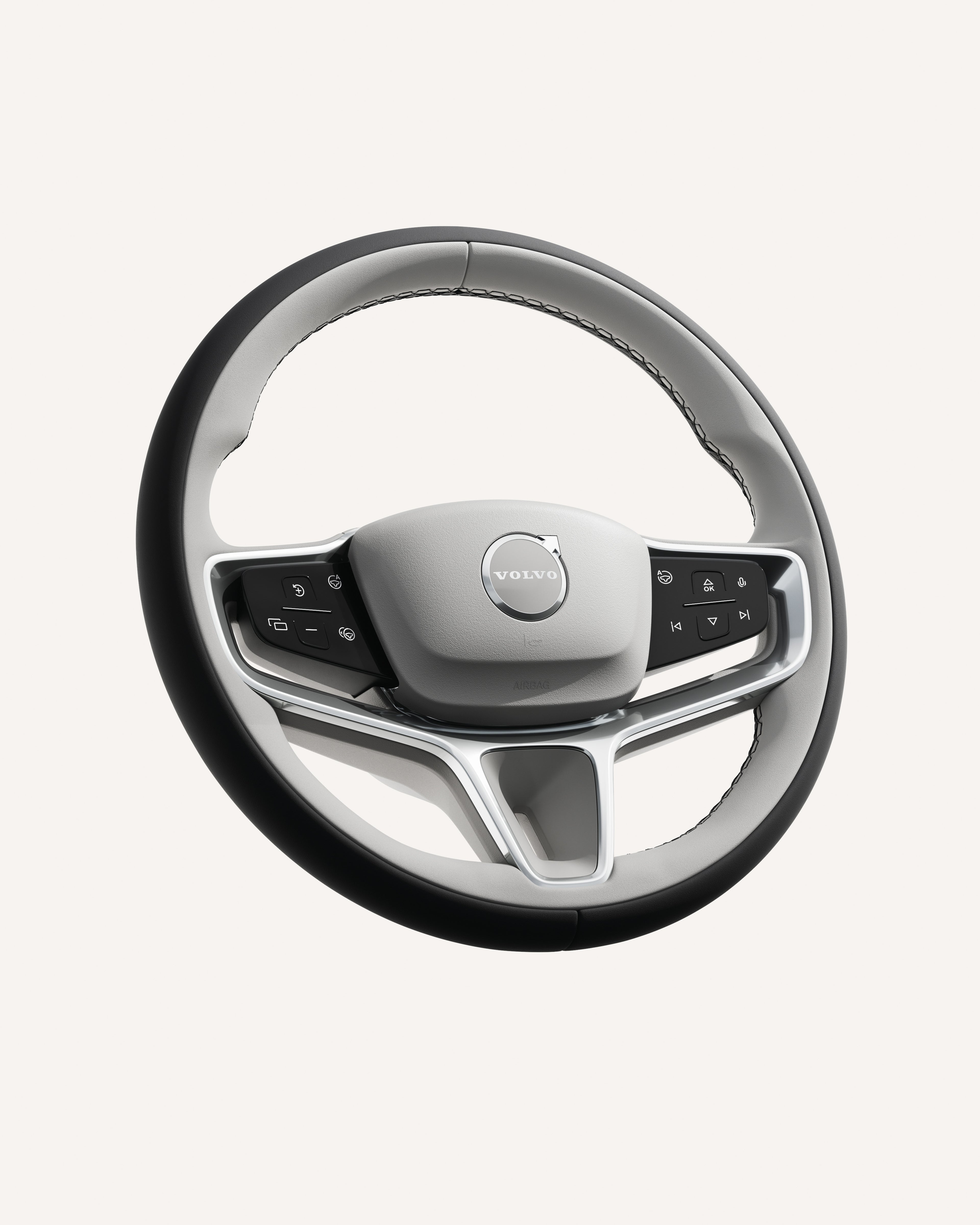 Close-up of the Volvo ES90 steering wheel, featuring integrated controls.