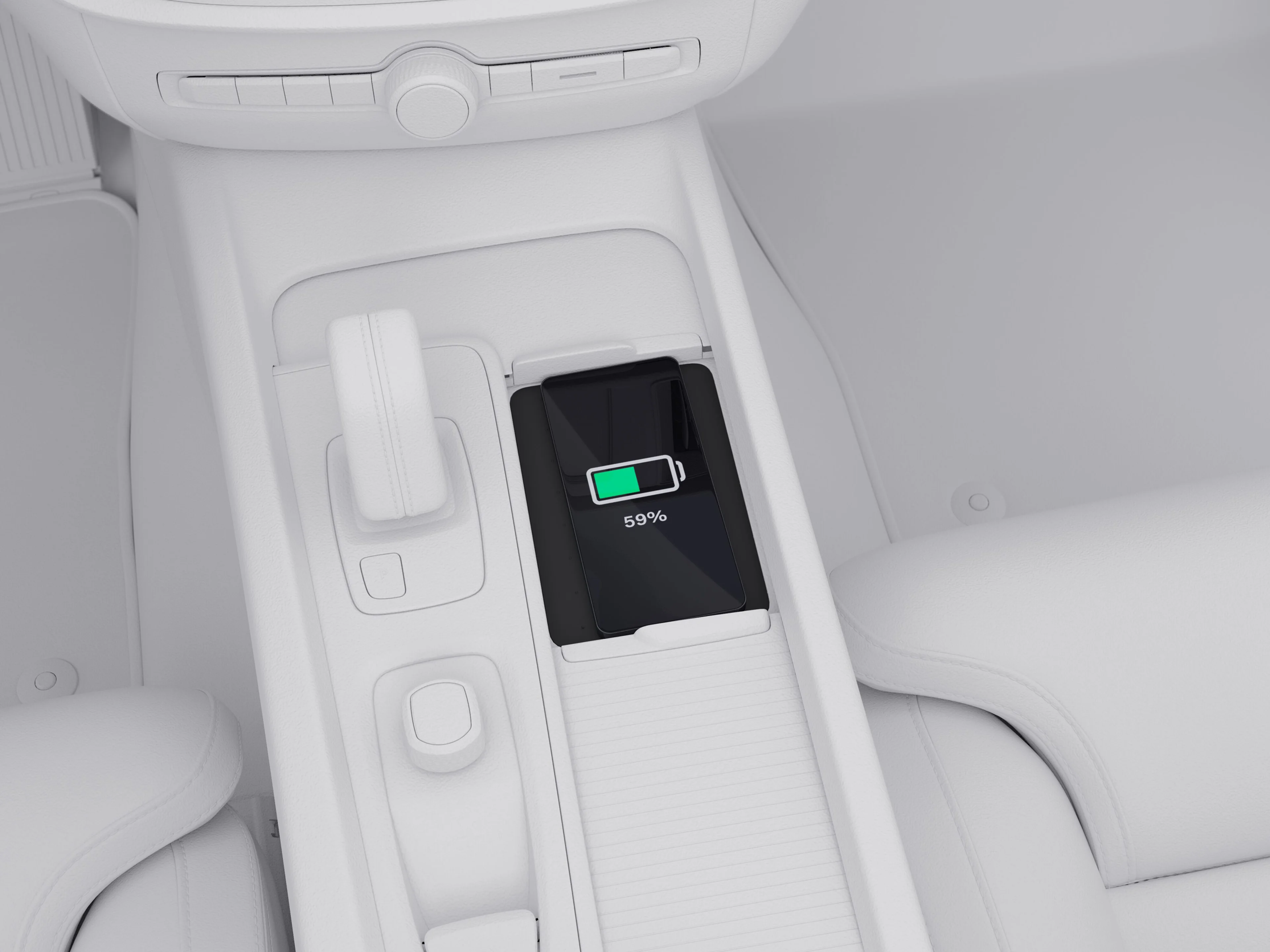 Mobile phone on the wireless charging pad in the centre console of the Volvo V60.