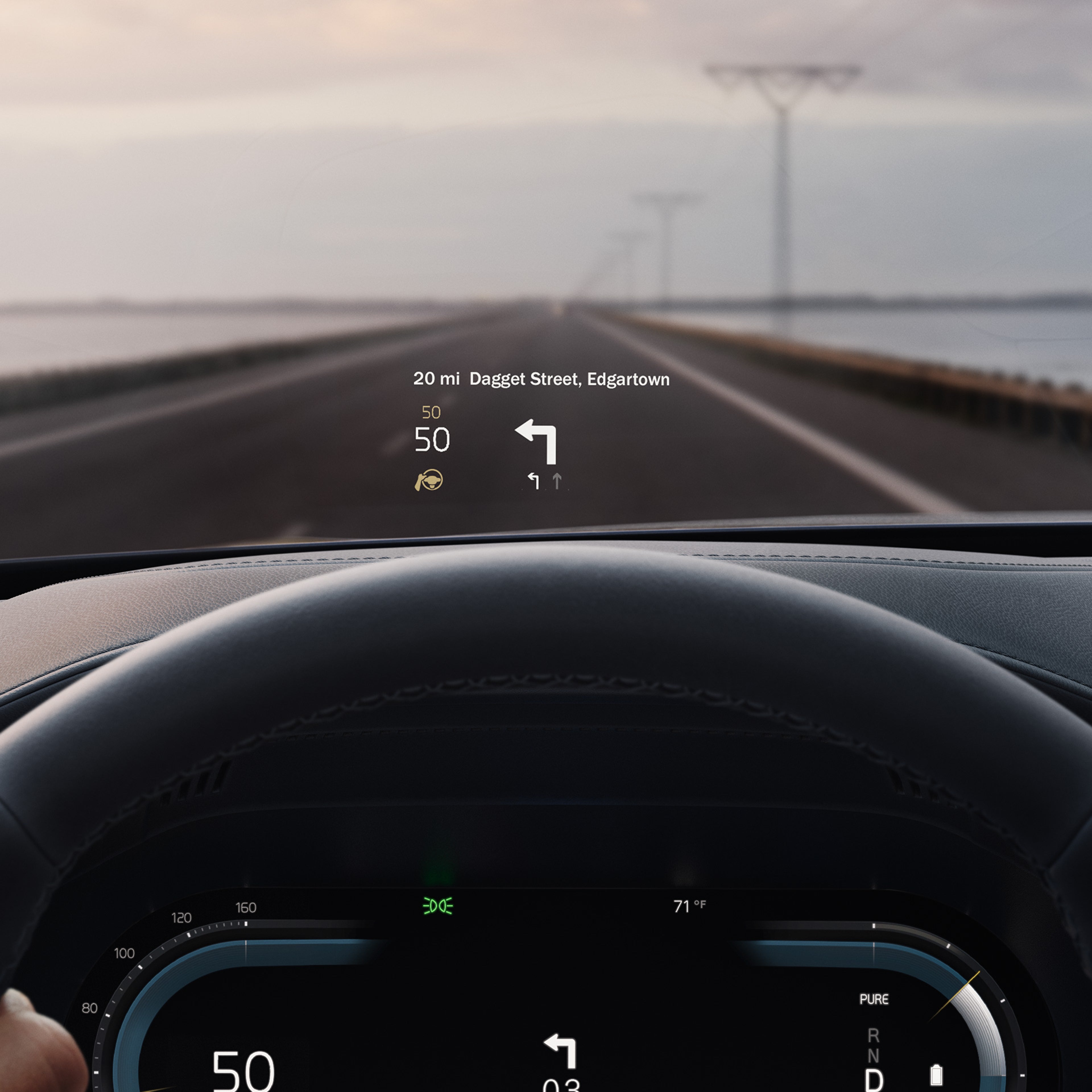 Inside a Volvo, head-up display showing driving speed and navigation on the windshield.