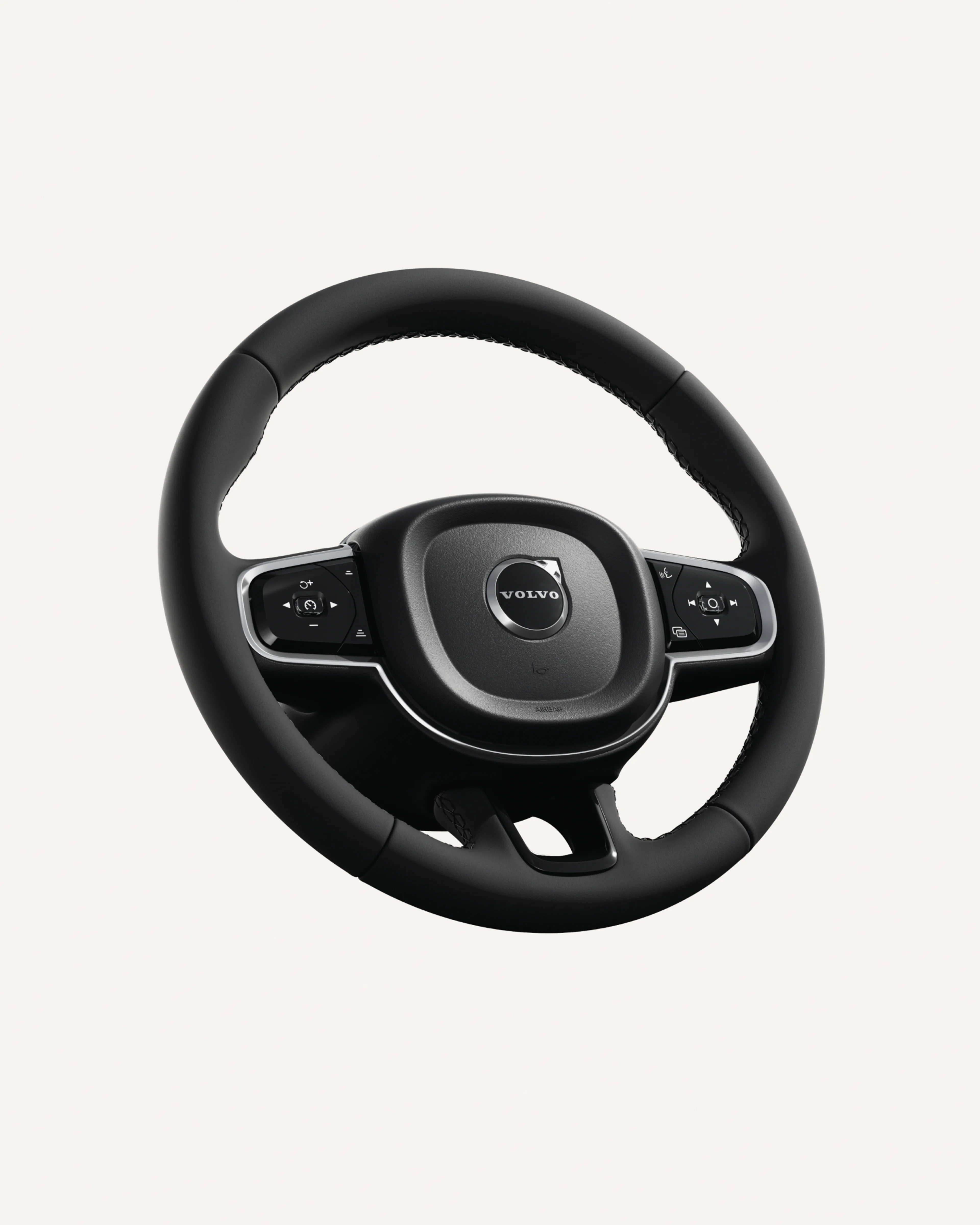 Close-up of the Volvo XC60 steering wheel, featuring integrated controls.
