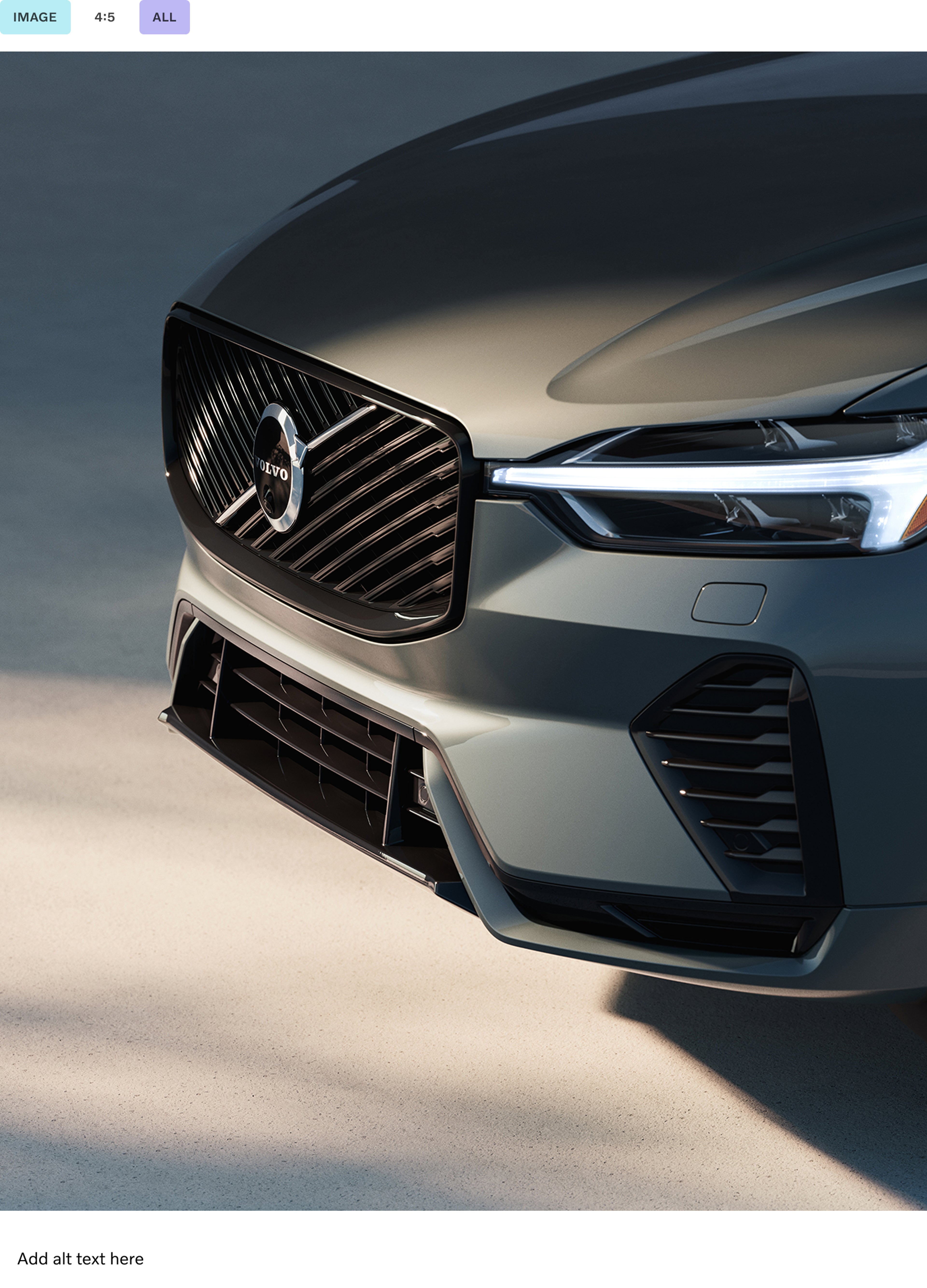 The front end of a Volvo XC60 plug-in hybrid SUV showcasing its grille and LED headlights.