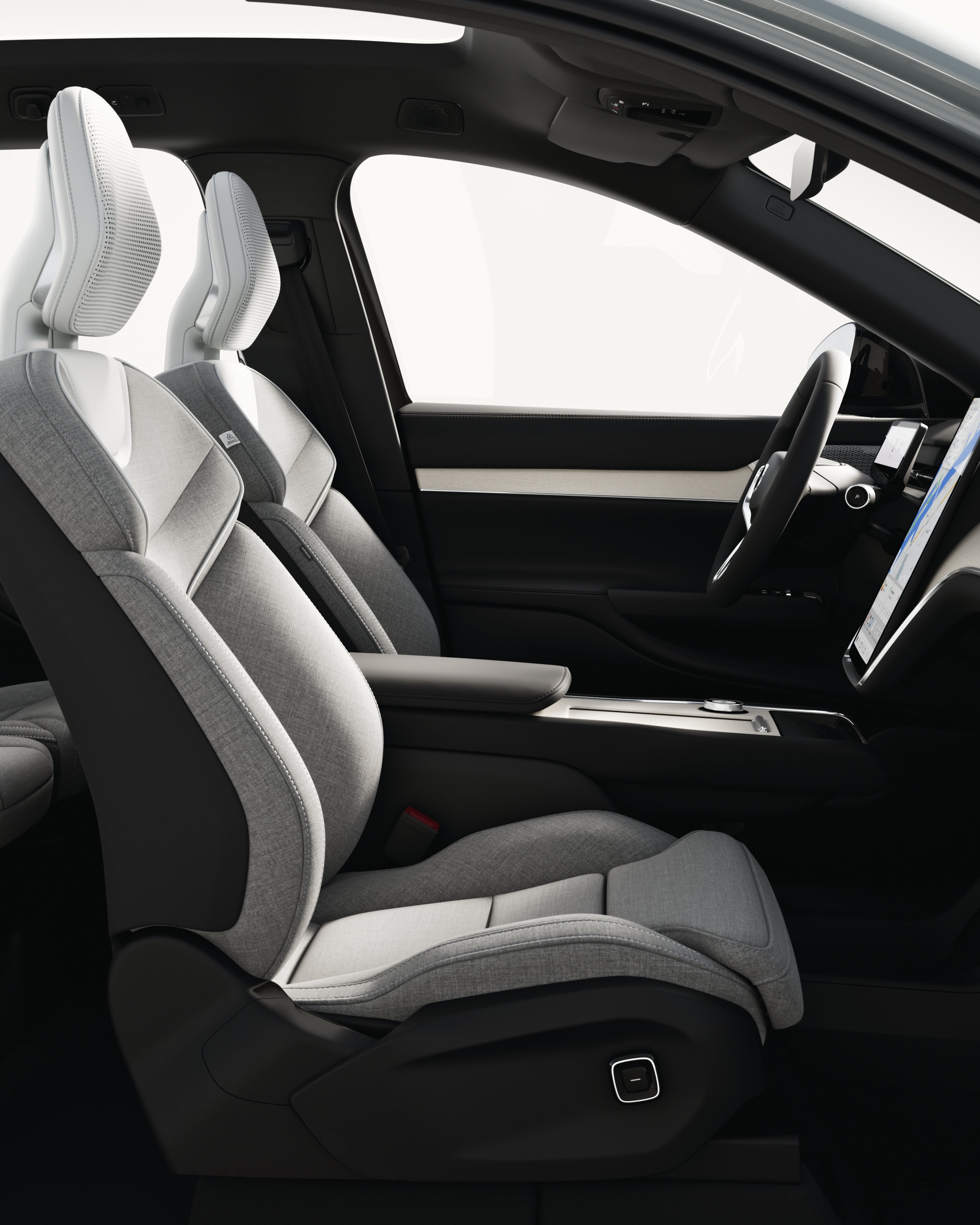 Open side view of the spacious interior and center console of the Volvo EX90.