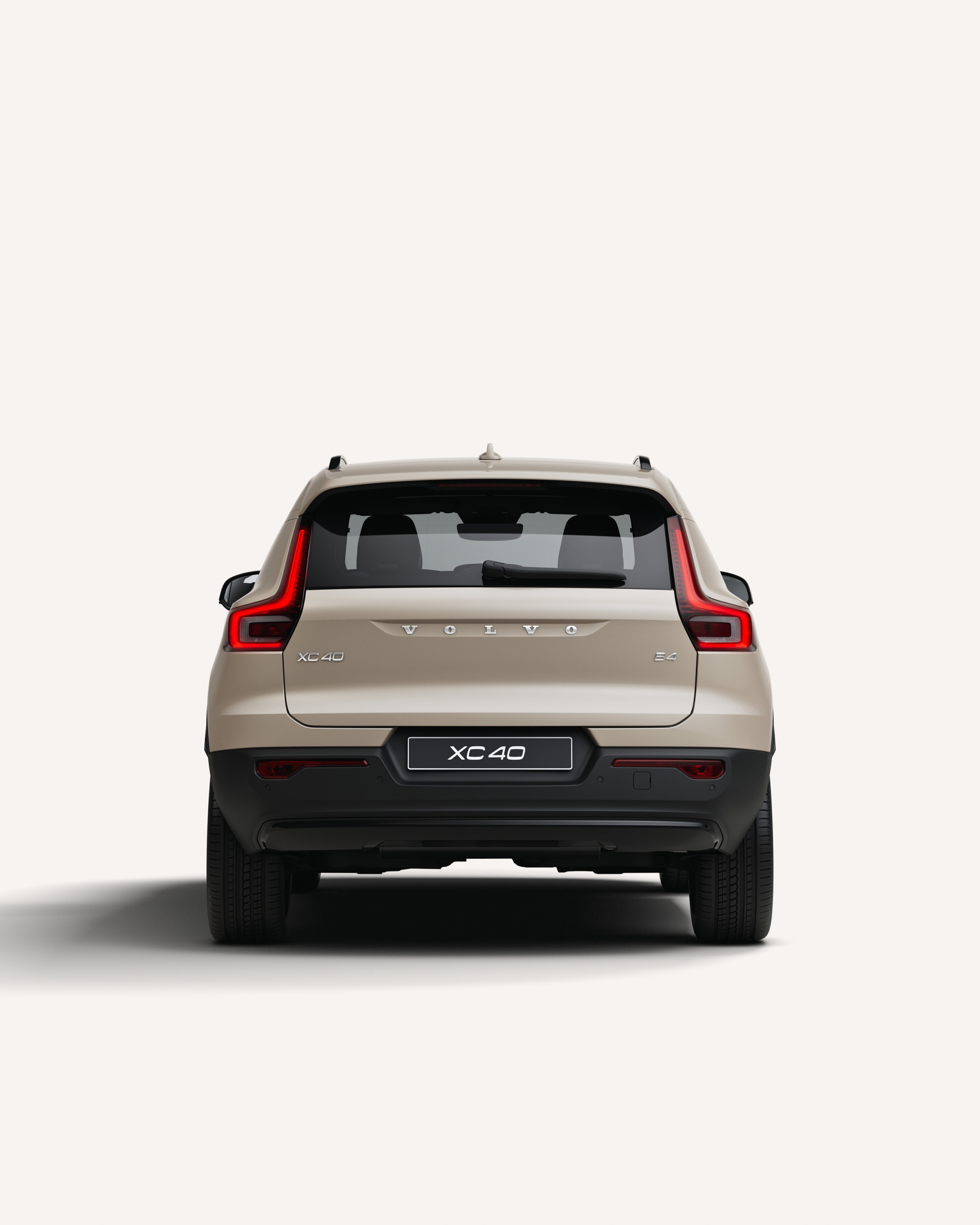 Rear view of the Volvo XC40 mild hybrid SUV in a white studio environment.