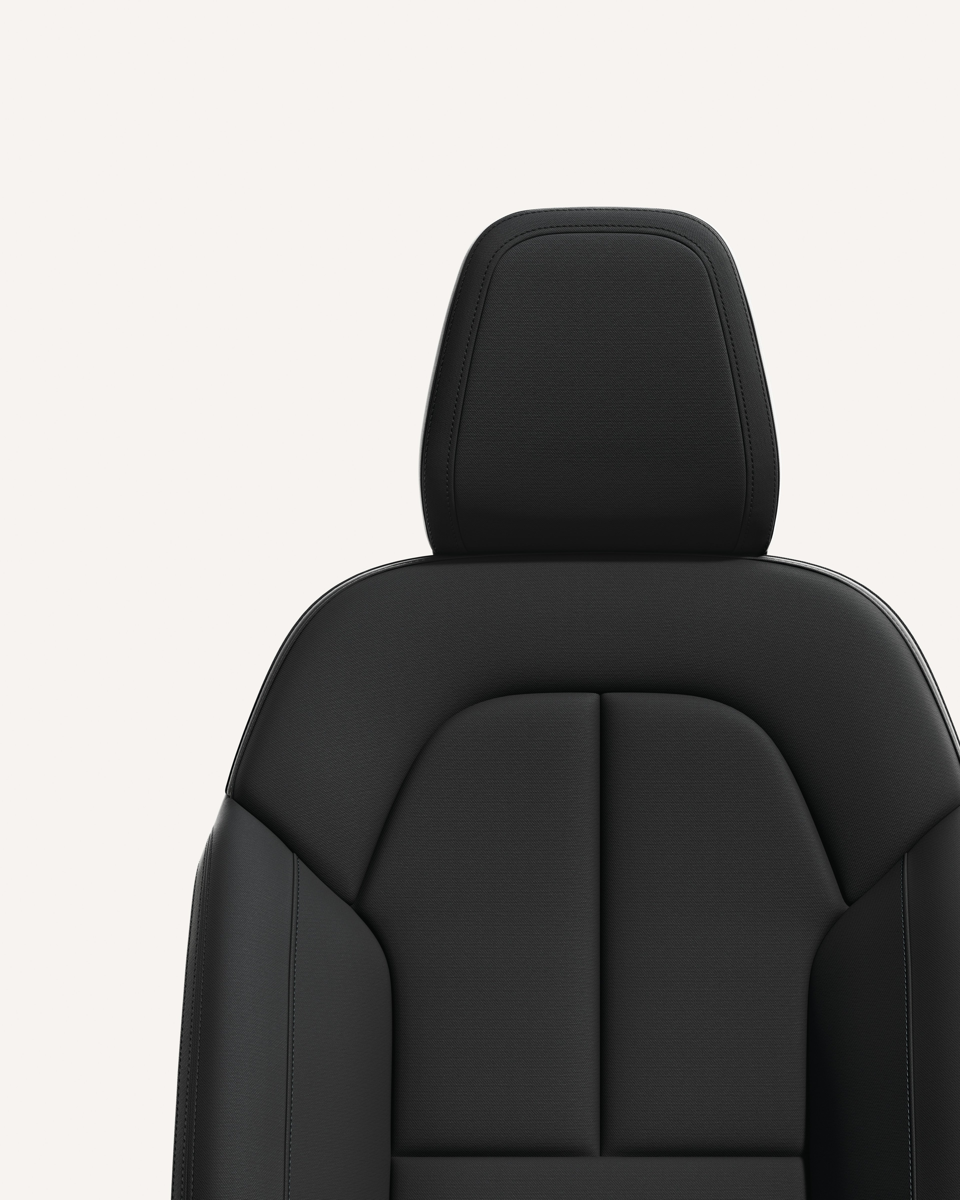 Volvo EC40-säte i materialet Charcoal med ergonomisk design och eleganta konturer.