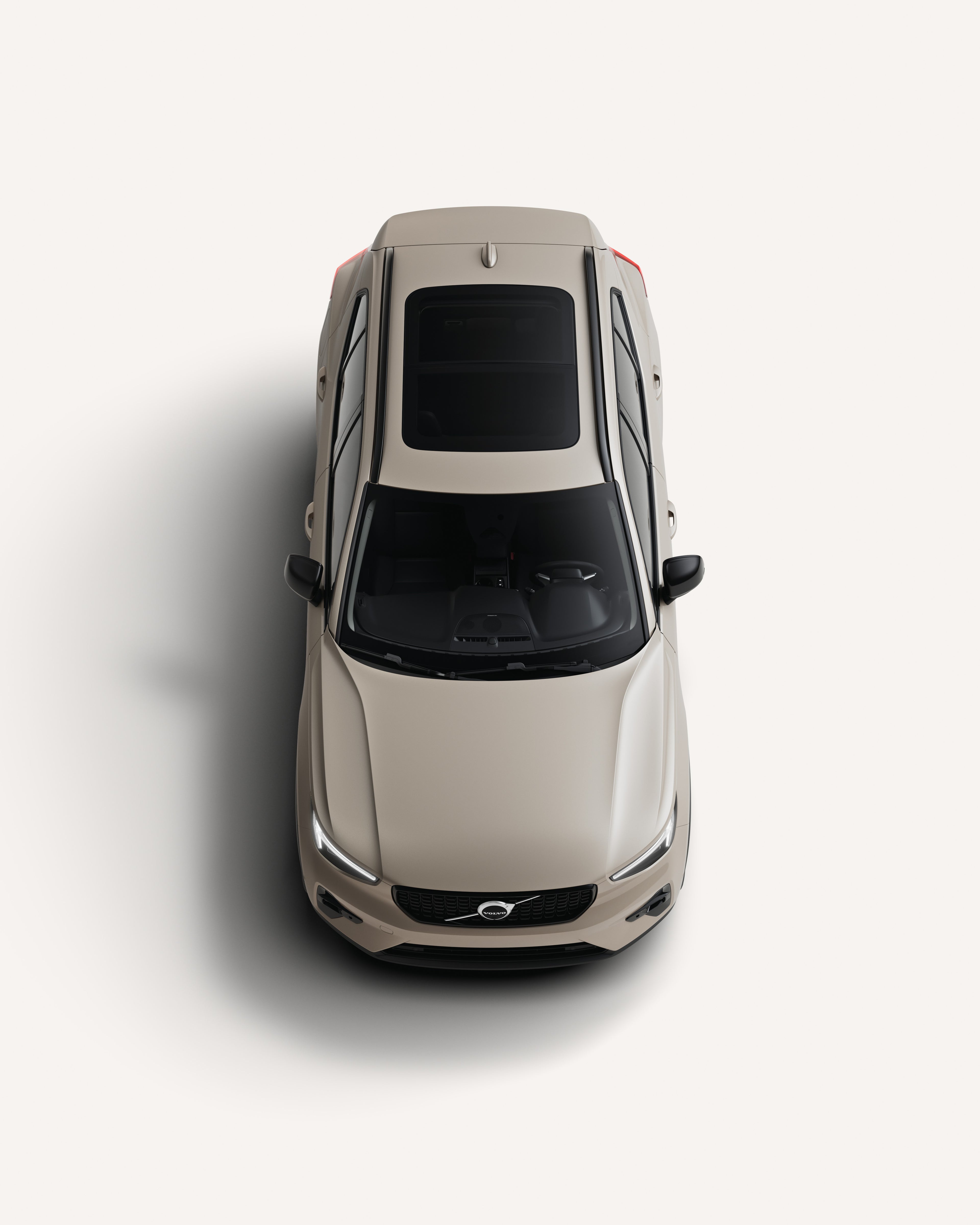 Top-down view of the Volvo XC40 mild hybrid SUV showcasing its roof in a white studio environment.