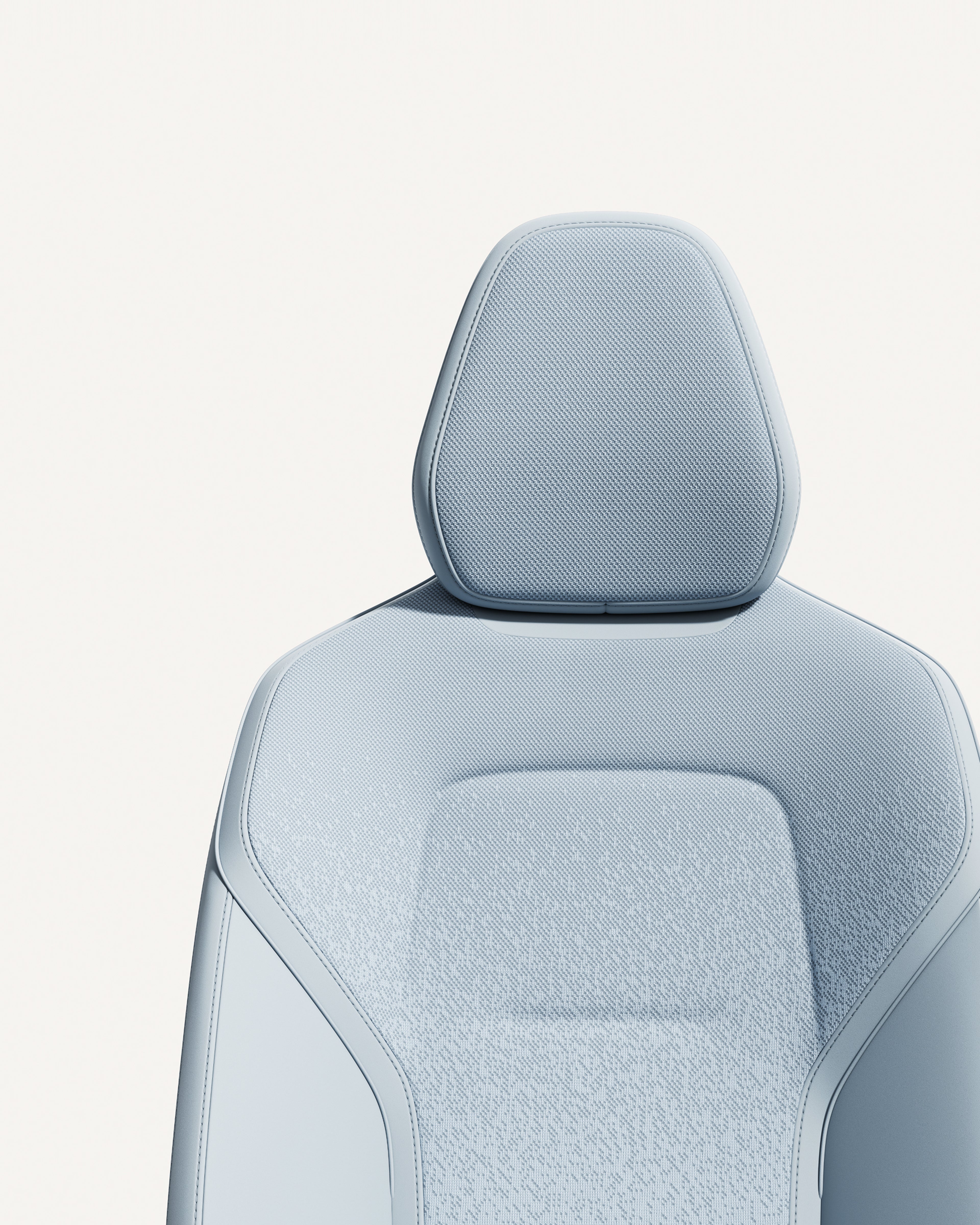 Volvo EX30 seat in material Breeze with ergonomic design and sleek contours.