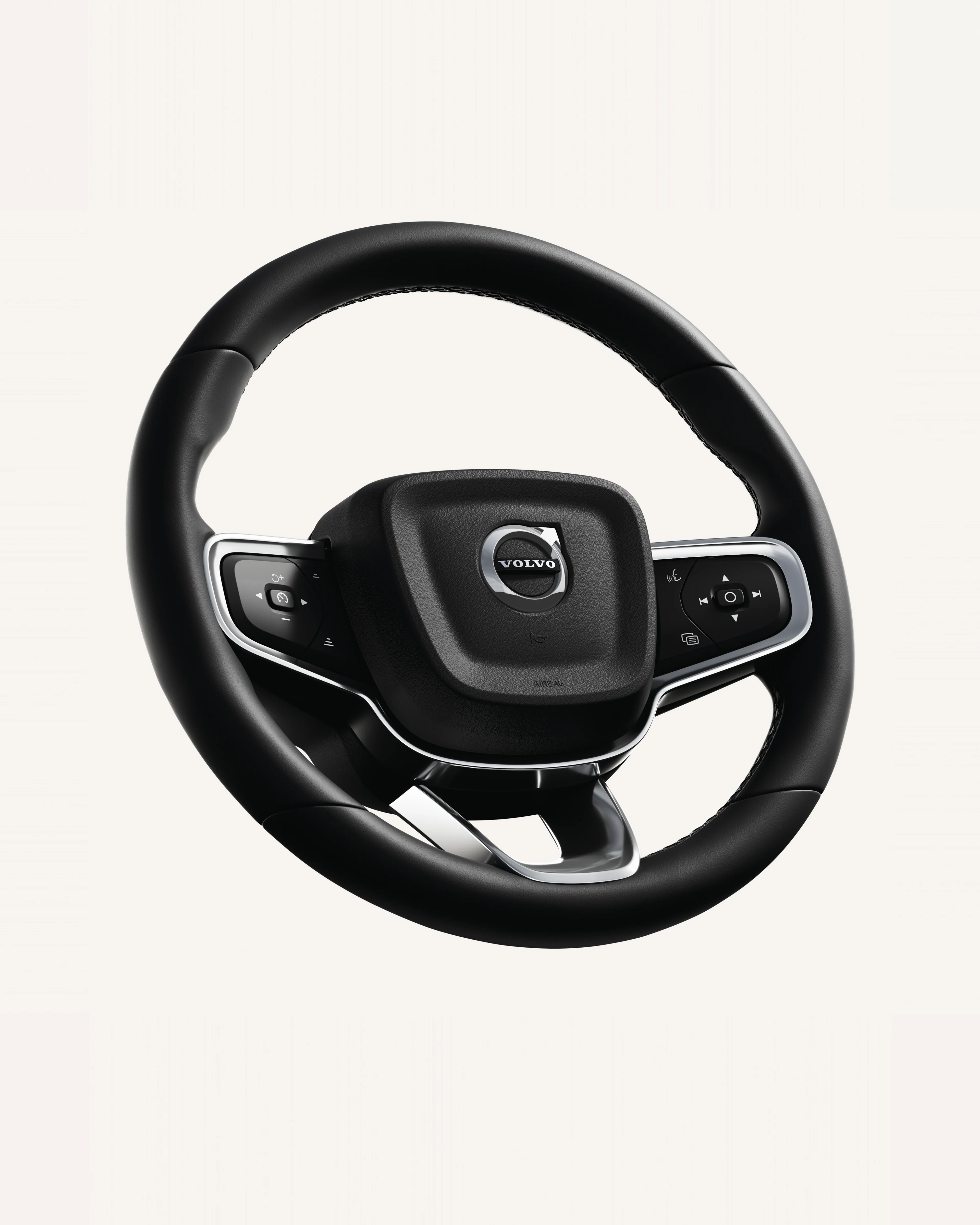 Close-up of the Volvo EC40 steering wheel, featuring integrated controls.