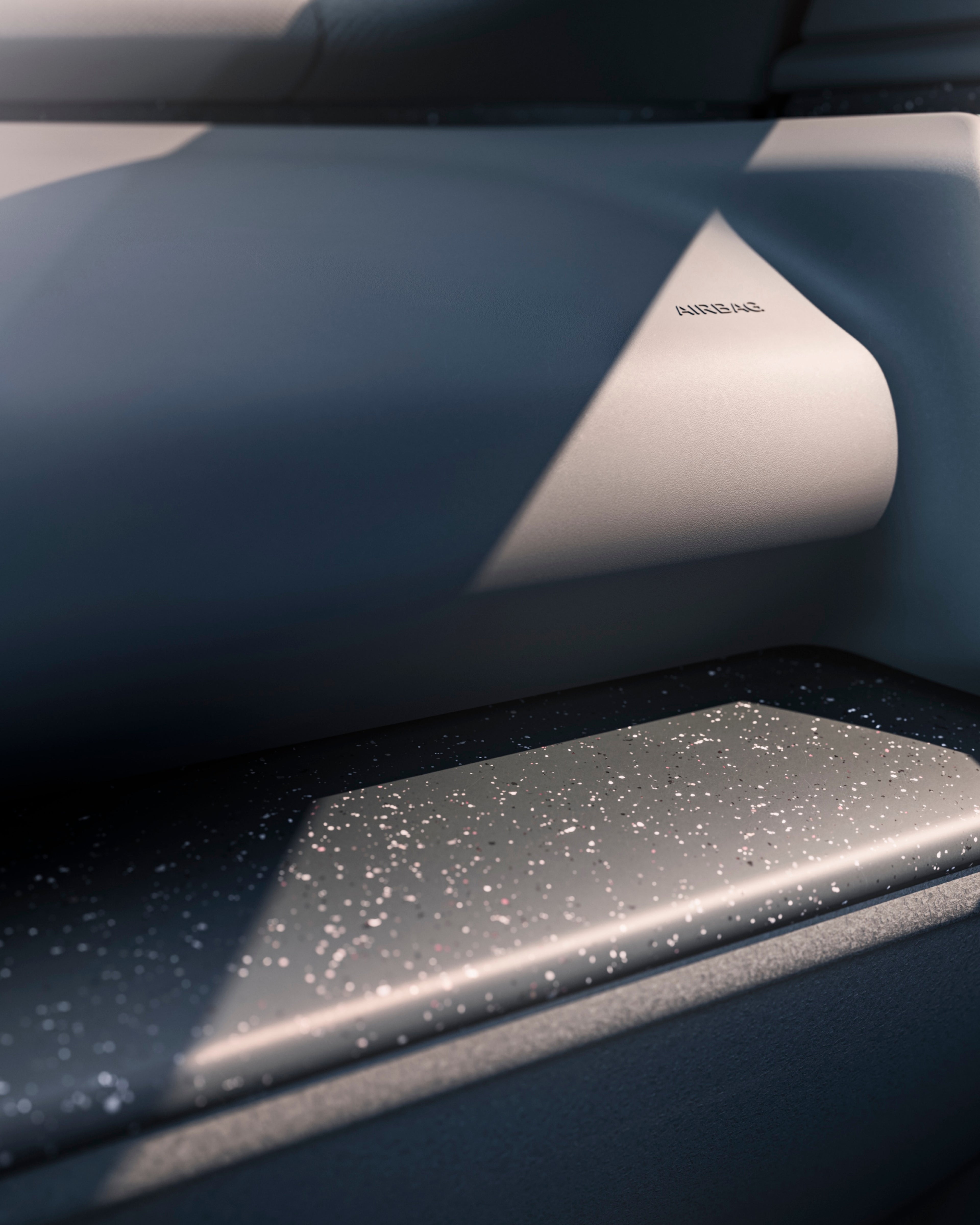 Close up of an EX30's interior front passenger shelf's particle recycled décor.