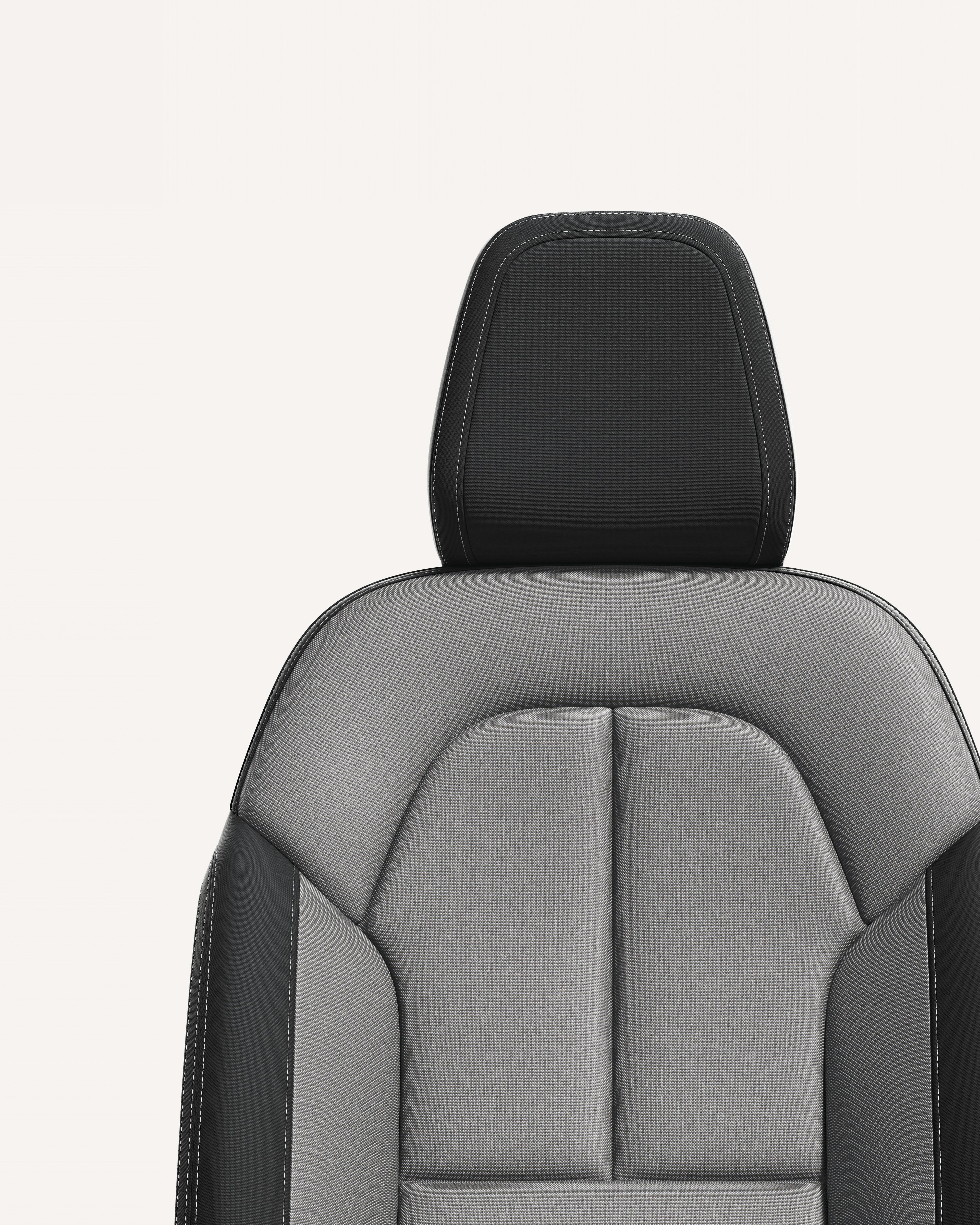 Крупен план на тапацирот на предните седишта во сива меланж боја за Volvo XC40 во бела студиска средина.