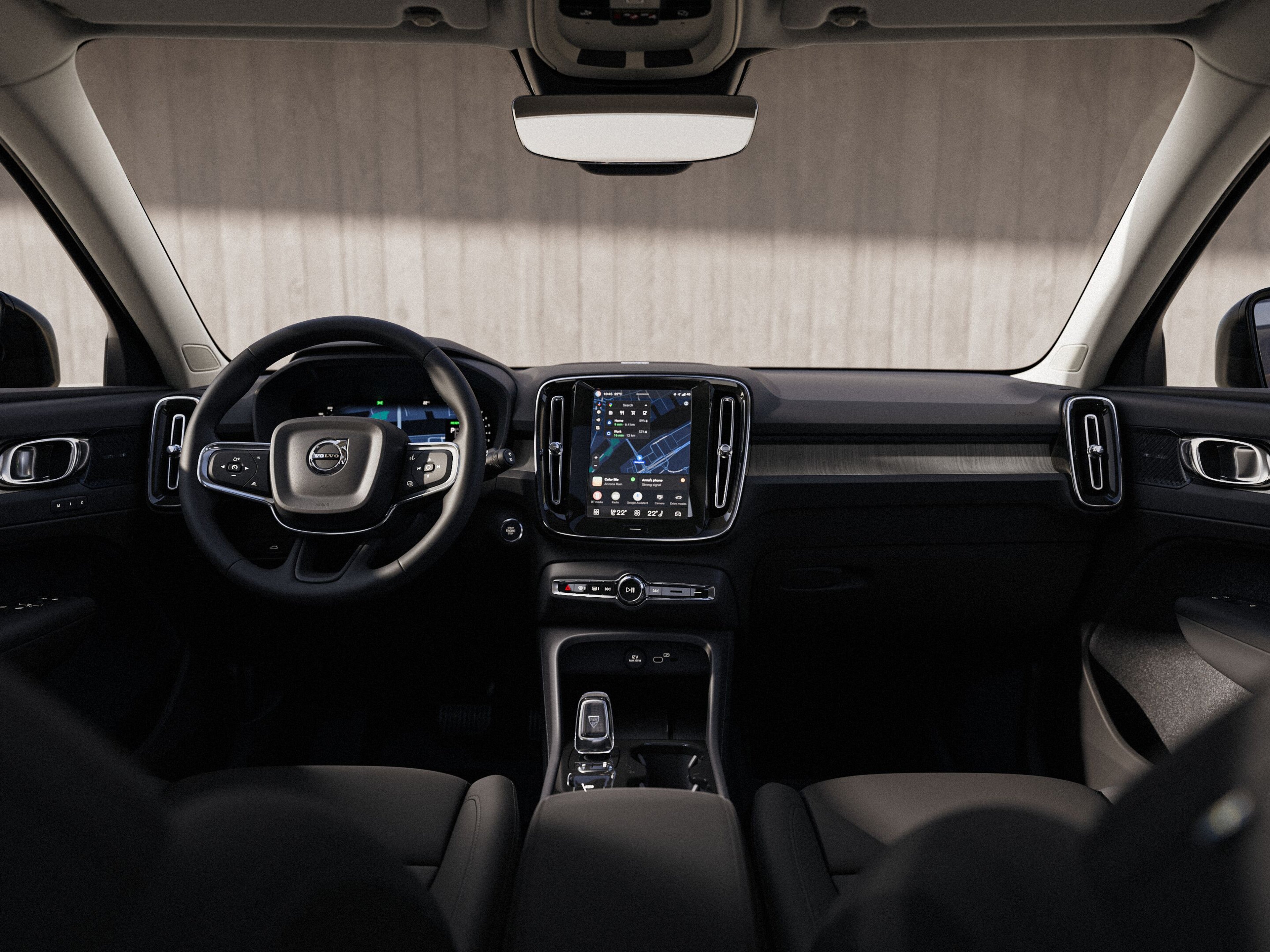 Внатрешен поглед на контролната табла на Volvo XC40, вклучувајќи го воланот и екранот на допир.