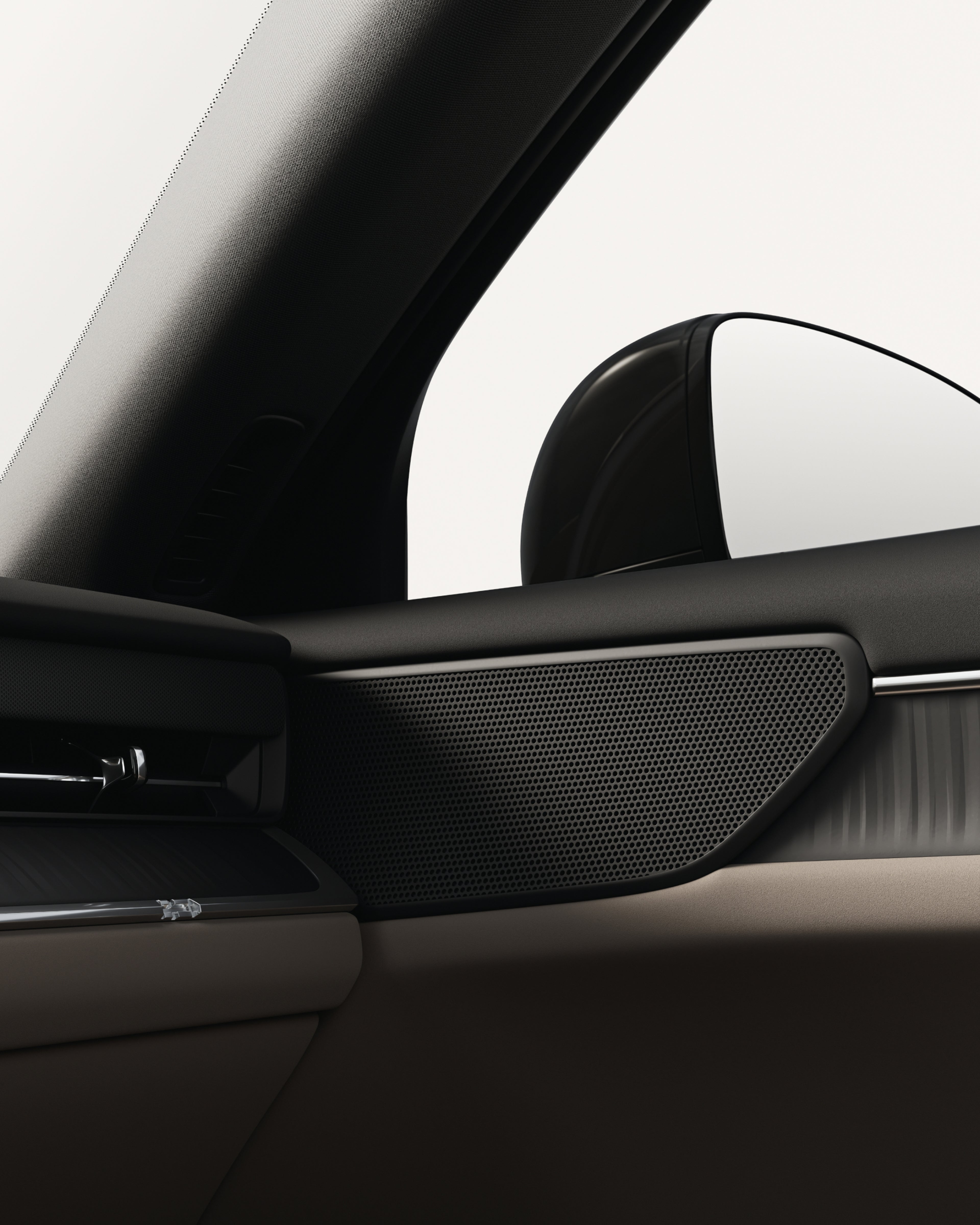 Close-up of the Volvo ES90 standard speaker with matte black grille.