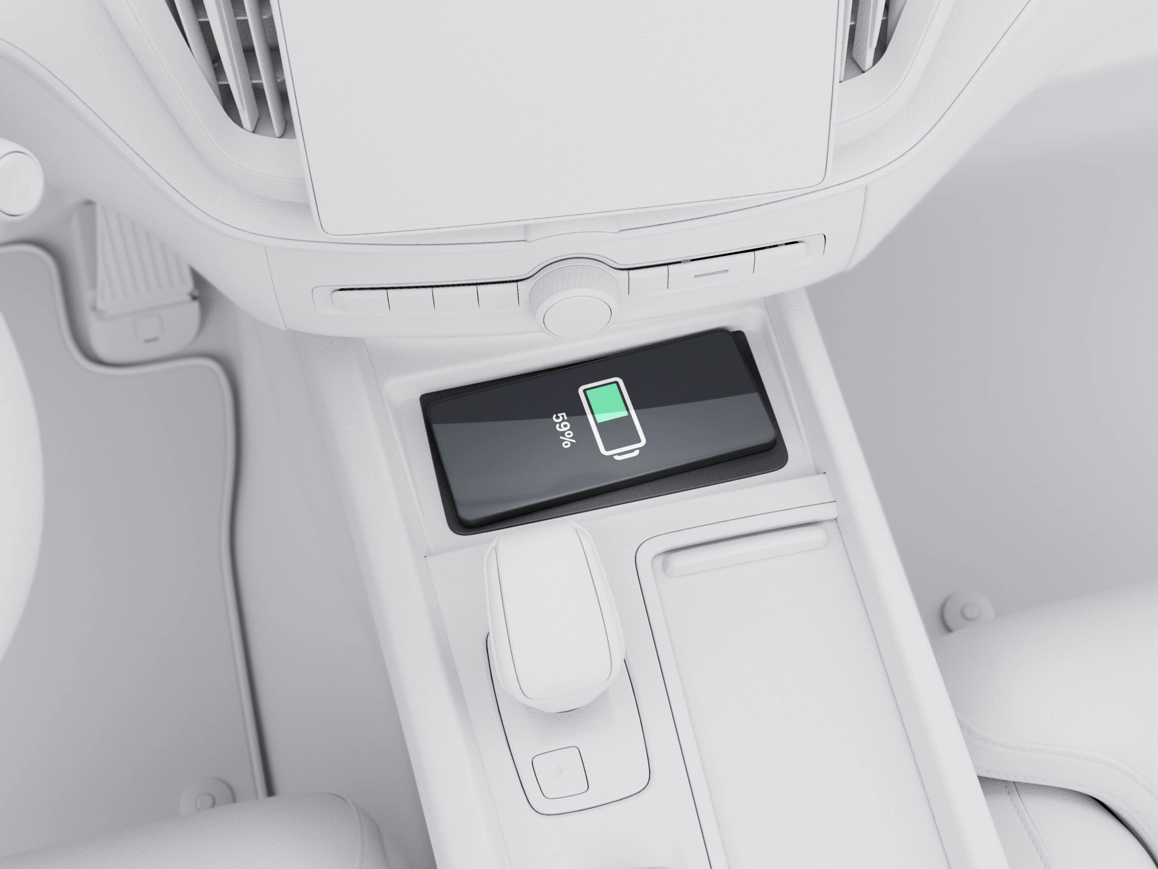 Telefonul mobil pe suportul de încărcare wireless din consola centrală a Volvo XC60.