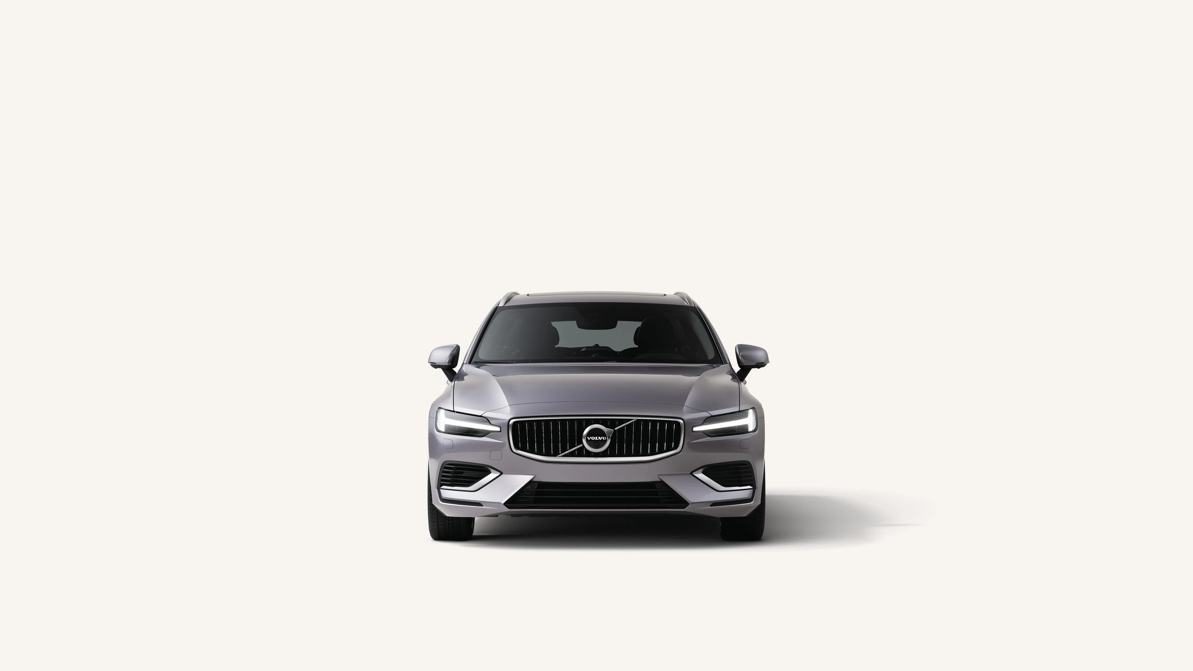 Front view of the Volvo V60 in a white studio environment.