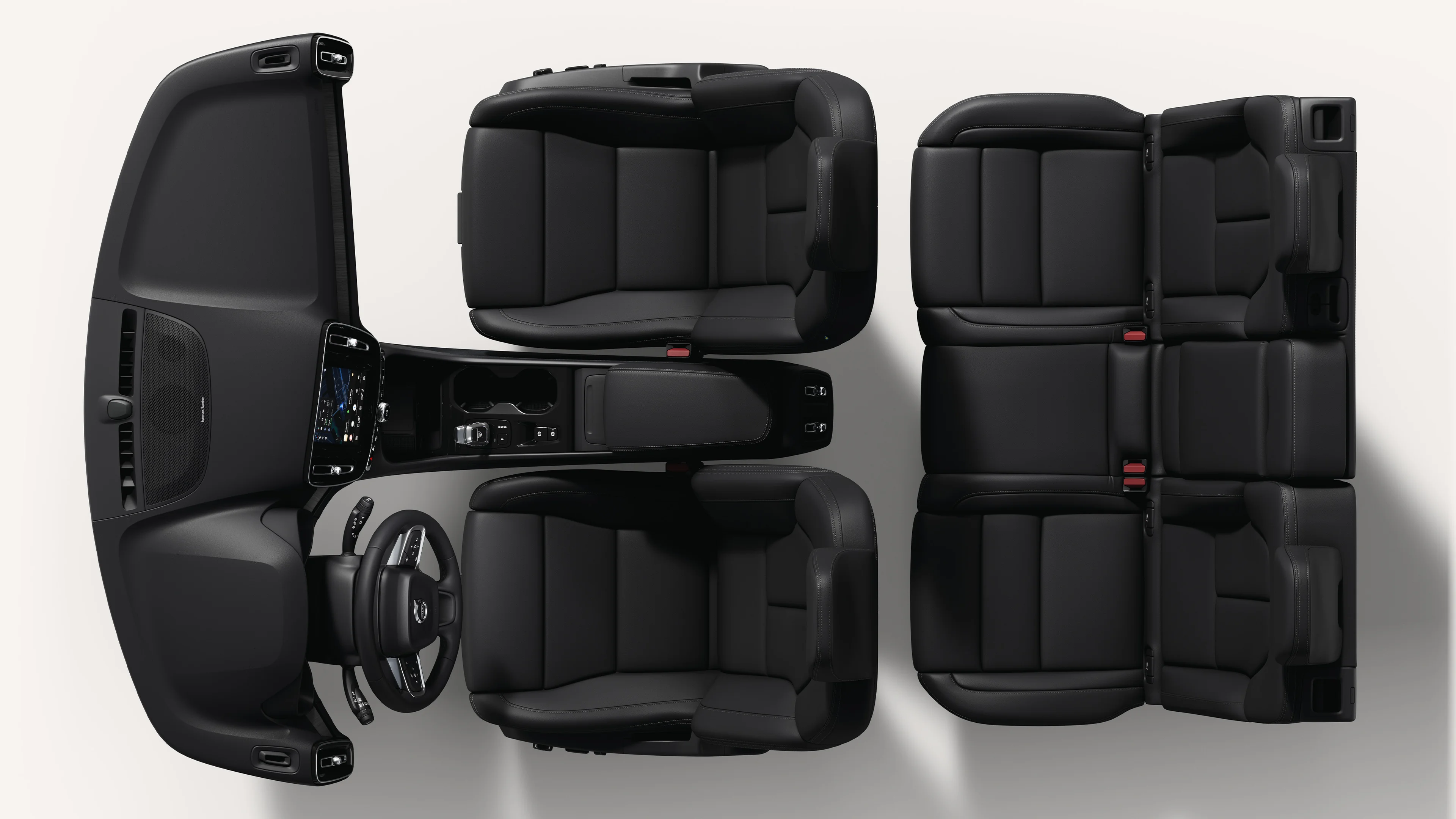 Top-down view of the Volvo XC40 interior, showcasing seats and central console in a white studio environment.