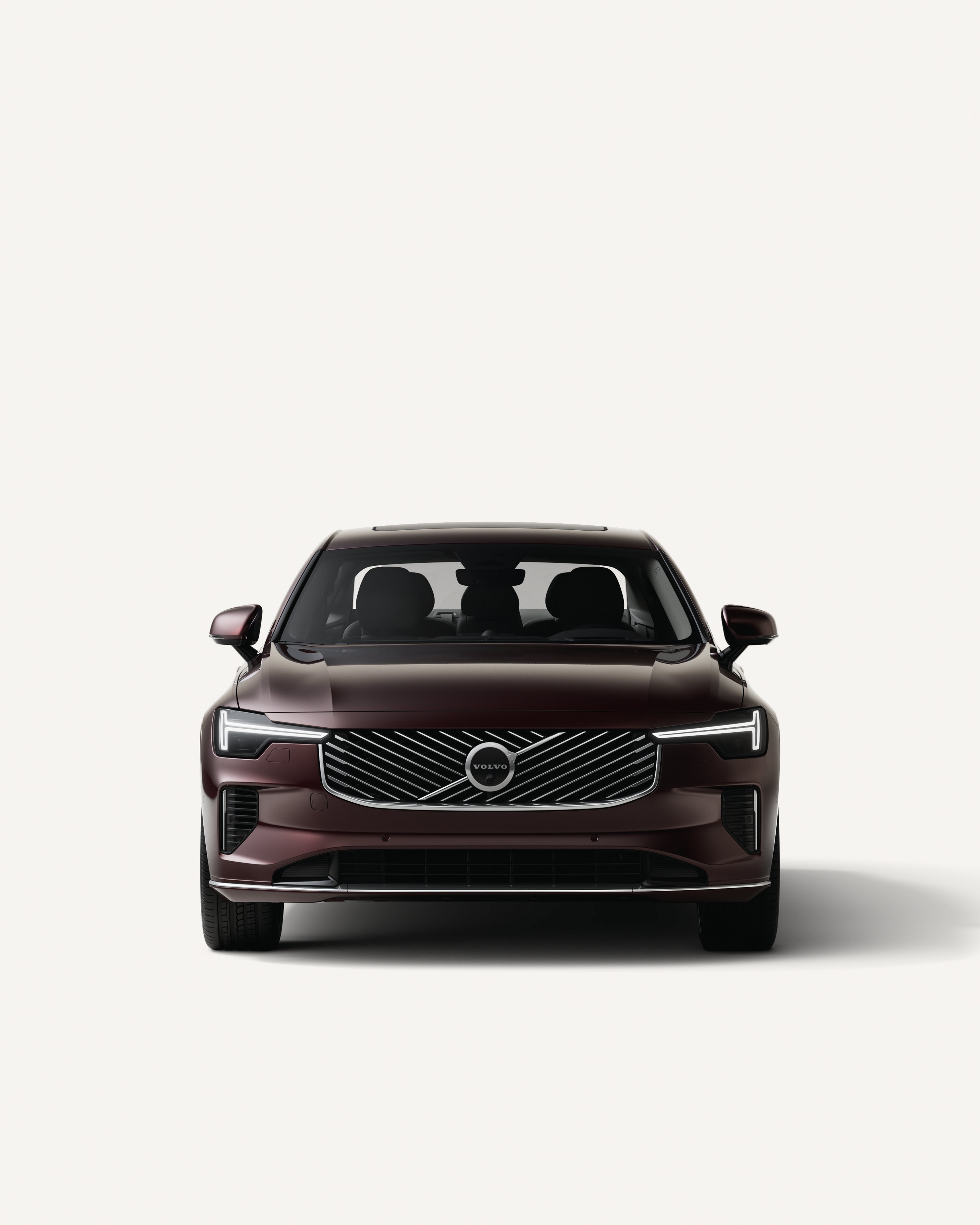 Front view of the Volvo S90 plug-in hybrid in a white studio environment.