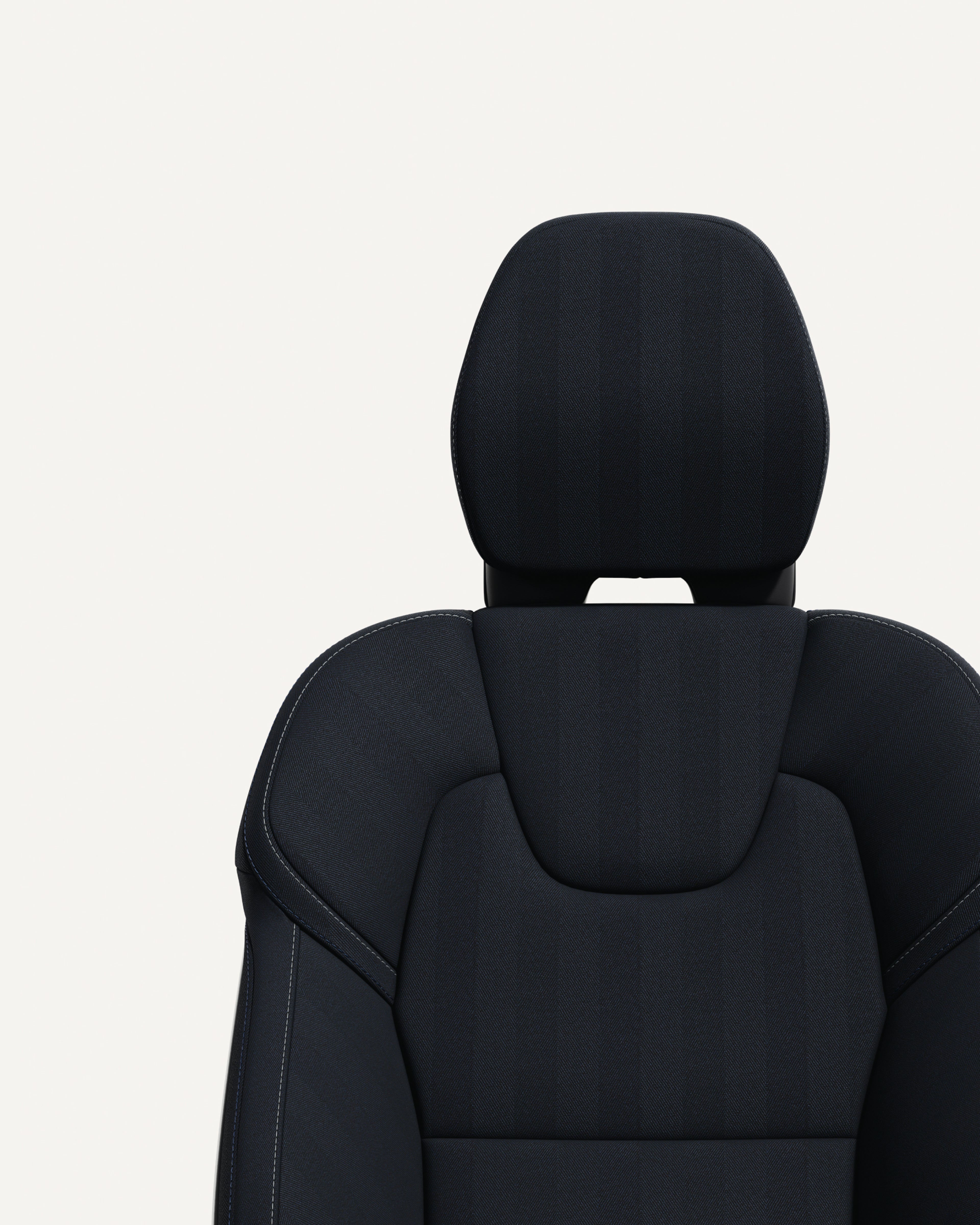 Close-up of the front seat navy upholstery in the Volvo XC60 midsize plug-in hybrid SUV.