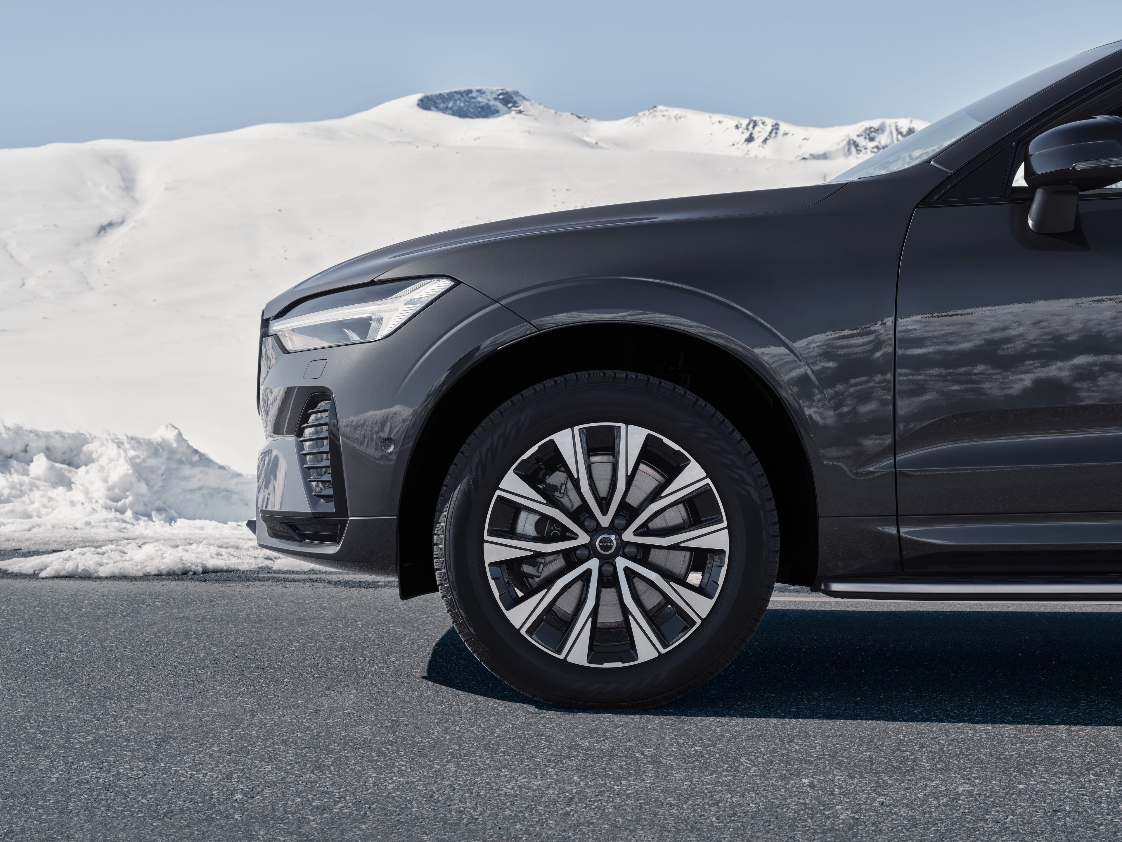 A partial front view of Volvo XC60 with winter tyres.