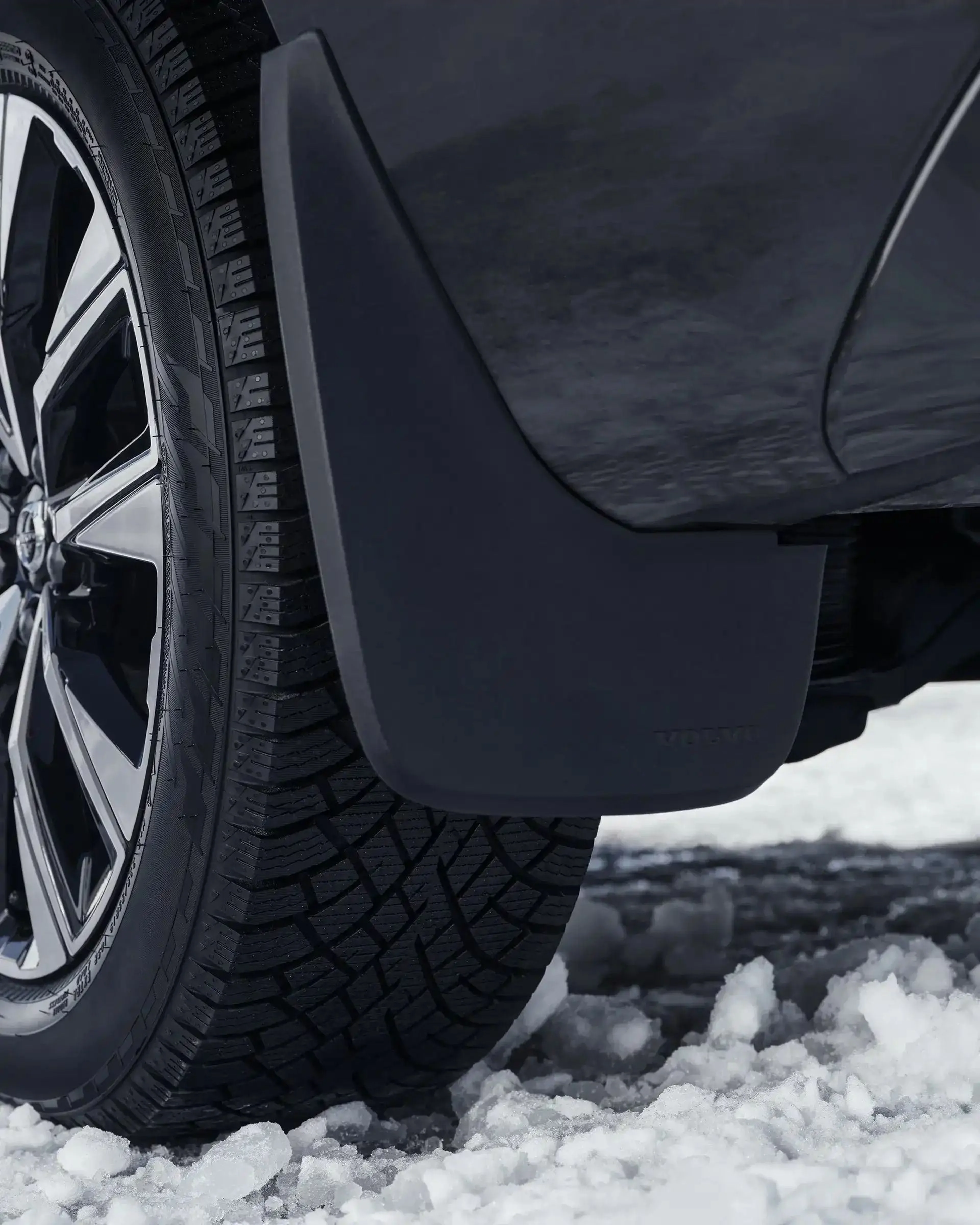 Close-up of a fitted mud flap on a Volvo XC60.