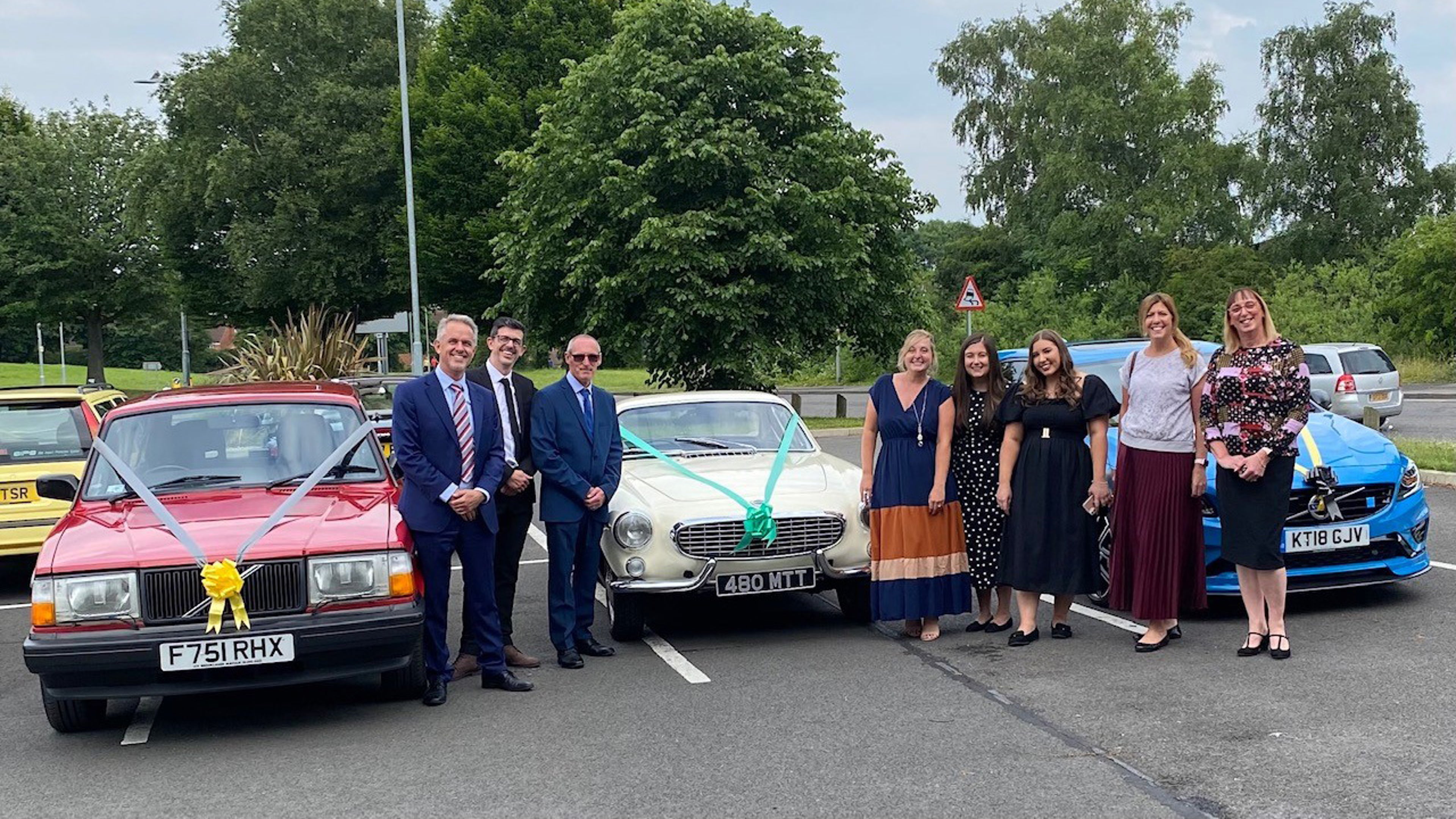 Volvo staff members on their way to the prom in the Volvo Car UK heritage fleet.