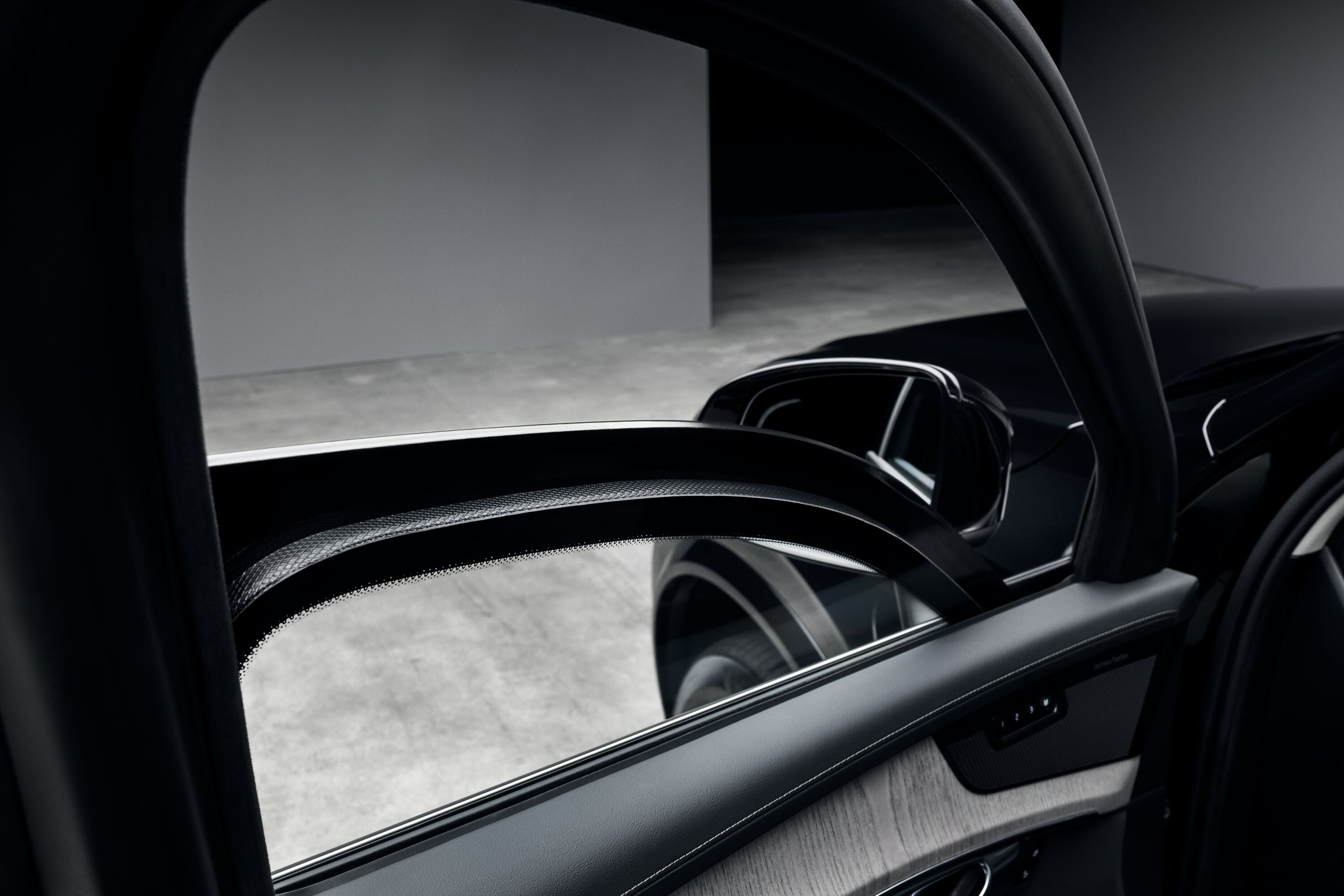 Specially developed laminated armoured glass on Volvo car door providing impact resistance and clear visibility.