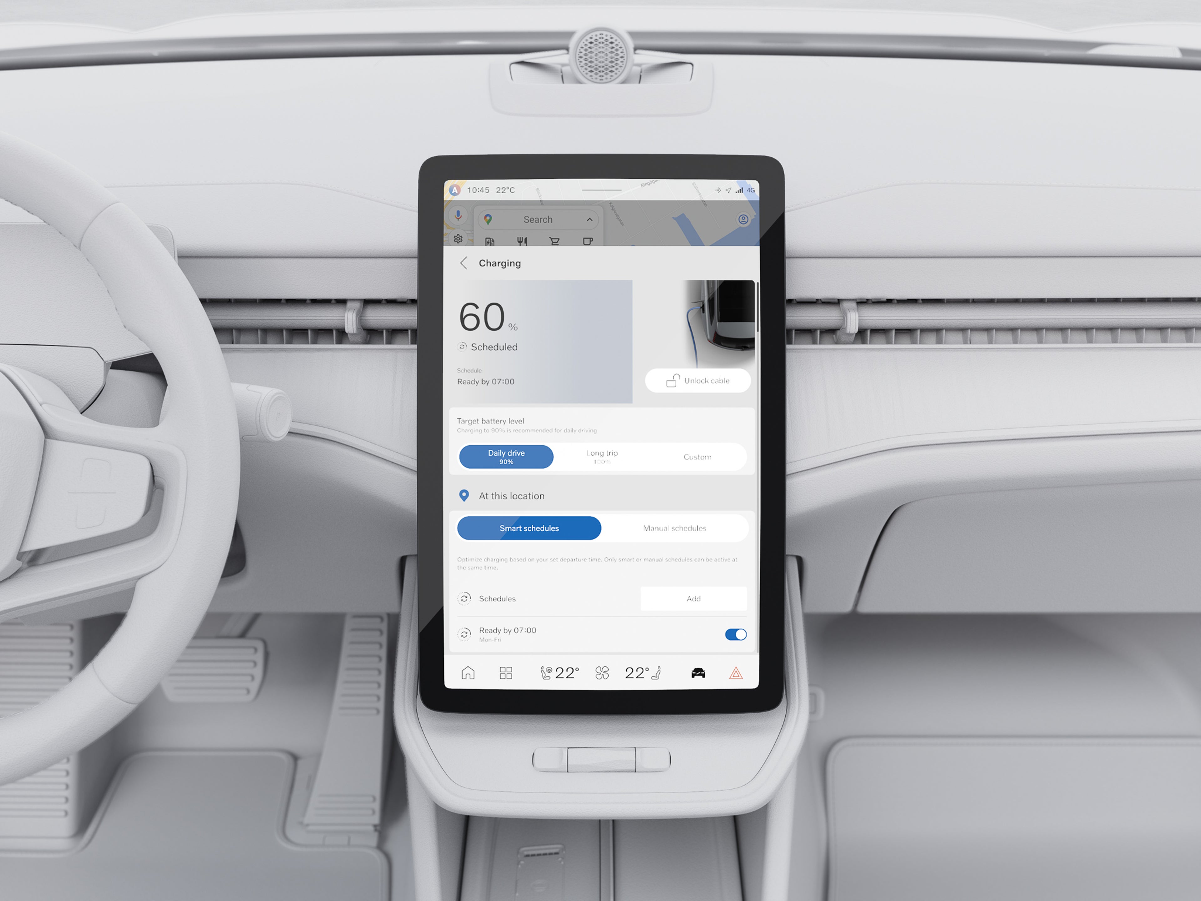 Nærbillede af interiøret i en Volvo EX30 med fokus på den store centrale touchscreen, der viser opladningsoplysninger. Minimalistisk instrumentbræt og rat er synlige i en lys kabine.