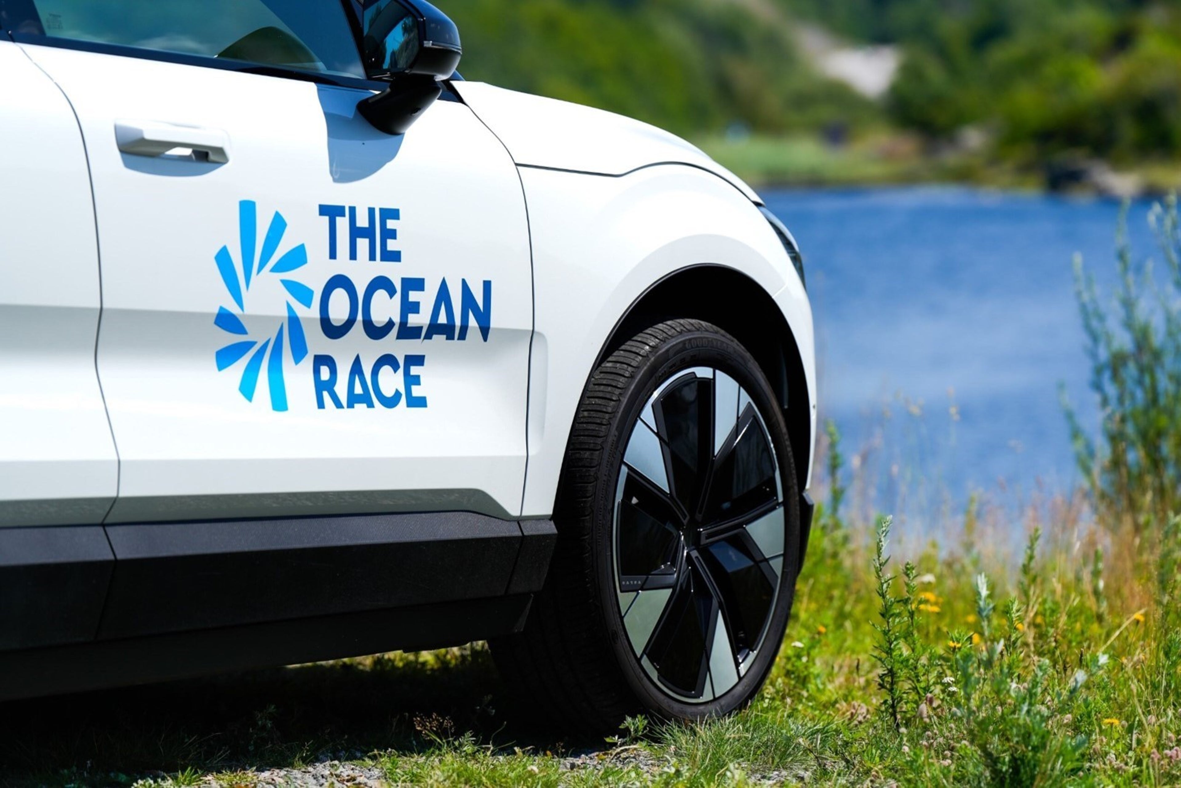 Volvo car parked by the ocean indicating partnership with The Ocean Race