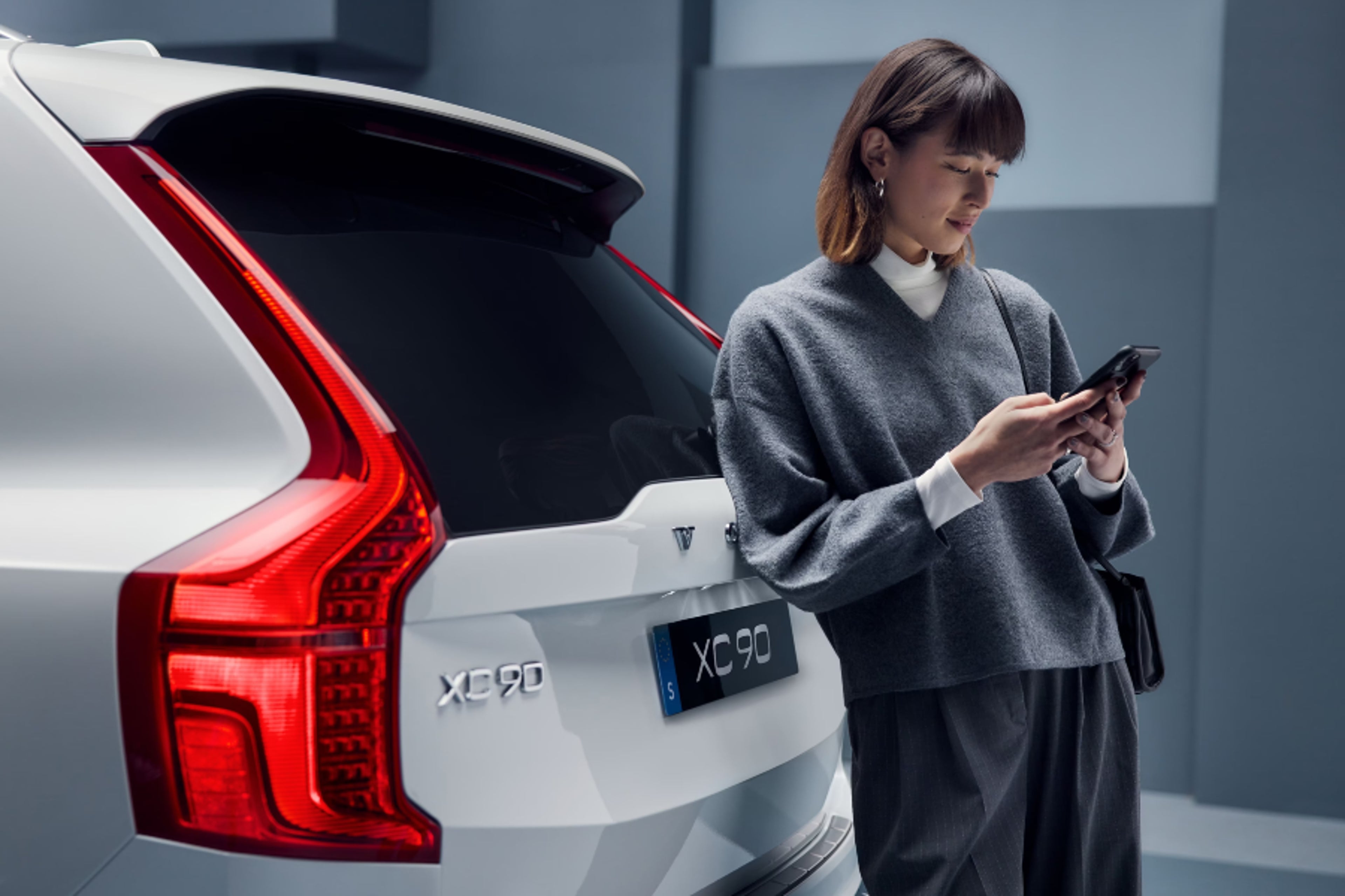 Person leaning on car