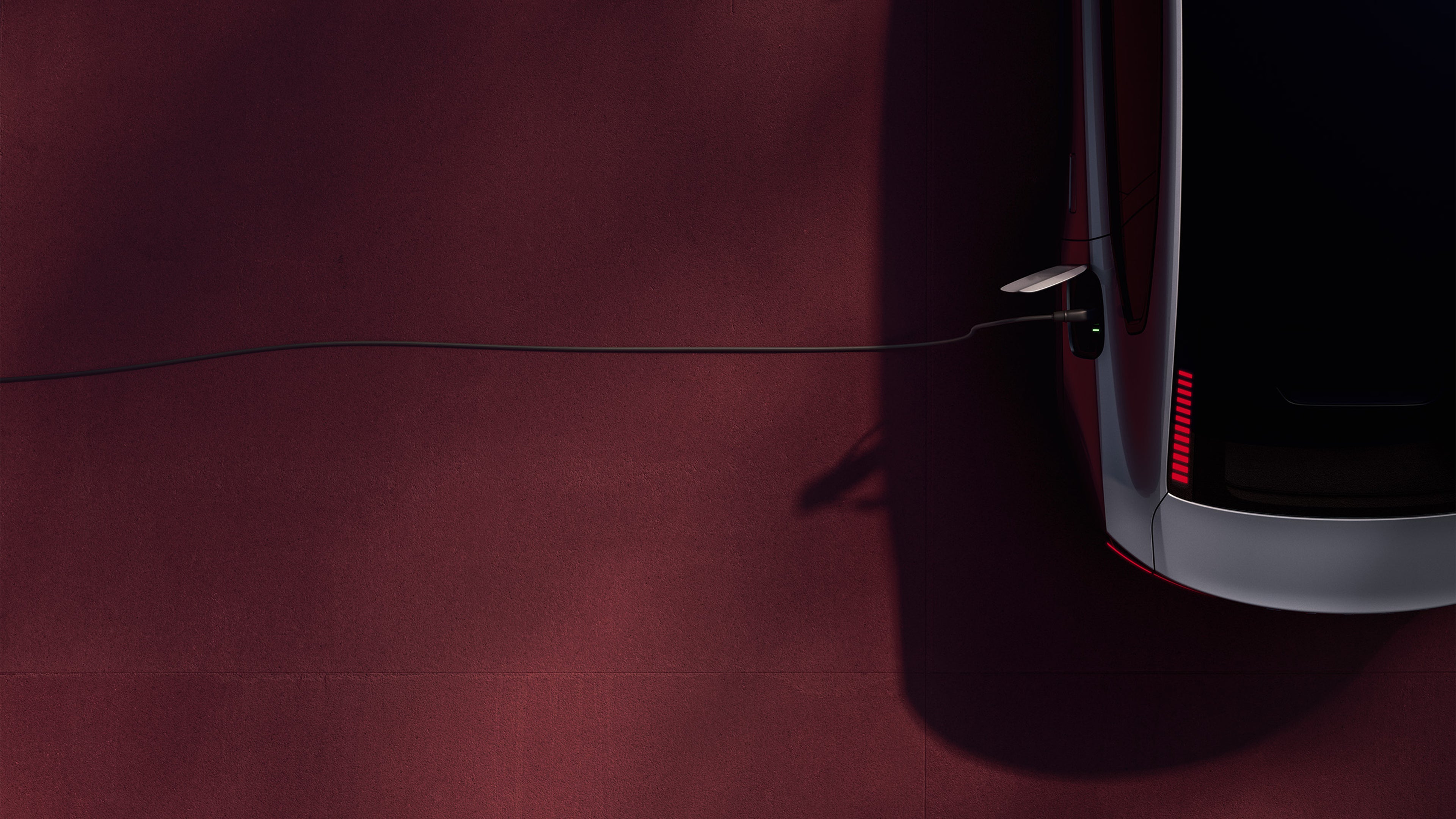 Volvo ES90 with a charging cord.