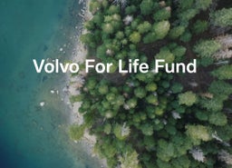 Aerial view of a forest coastline with the text "Volvo For Life Fund" overlaying the image.