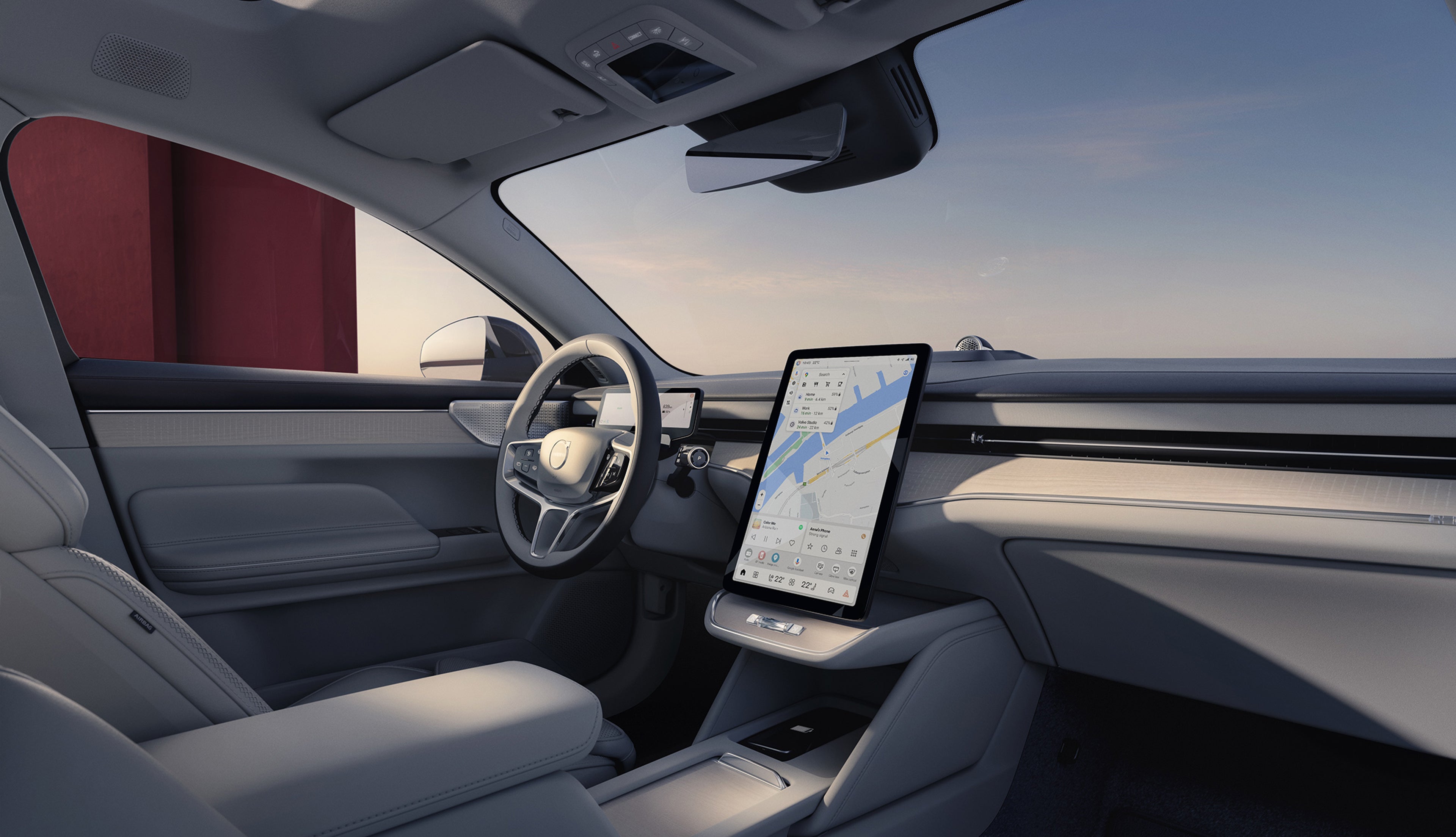 Внатрешноста на Volvo ES90, нашиот следен целосно електричен автомобил, на која се гледа голем централен екран на допир со Google Maps, панорамски подвижен покрив и седишта во светли тонови.