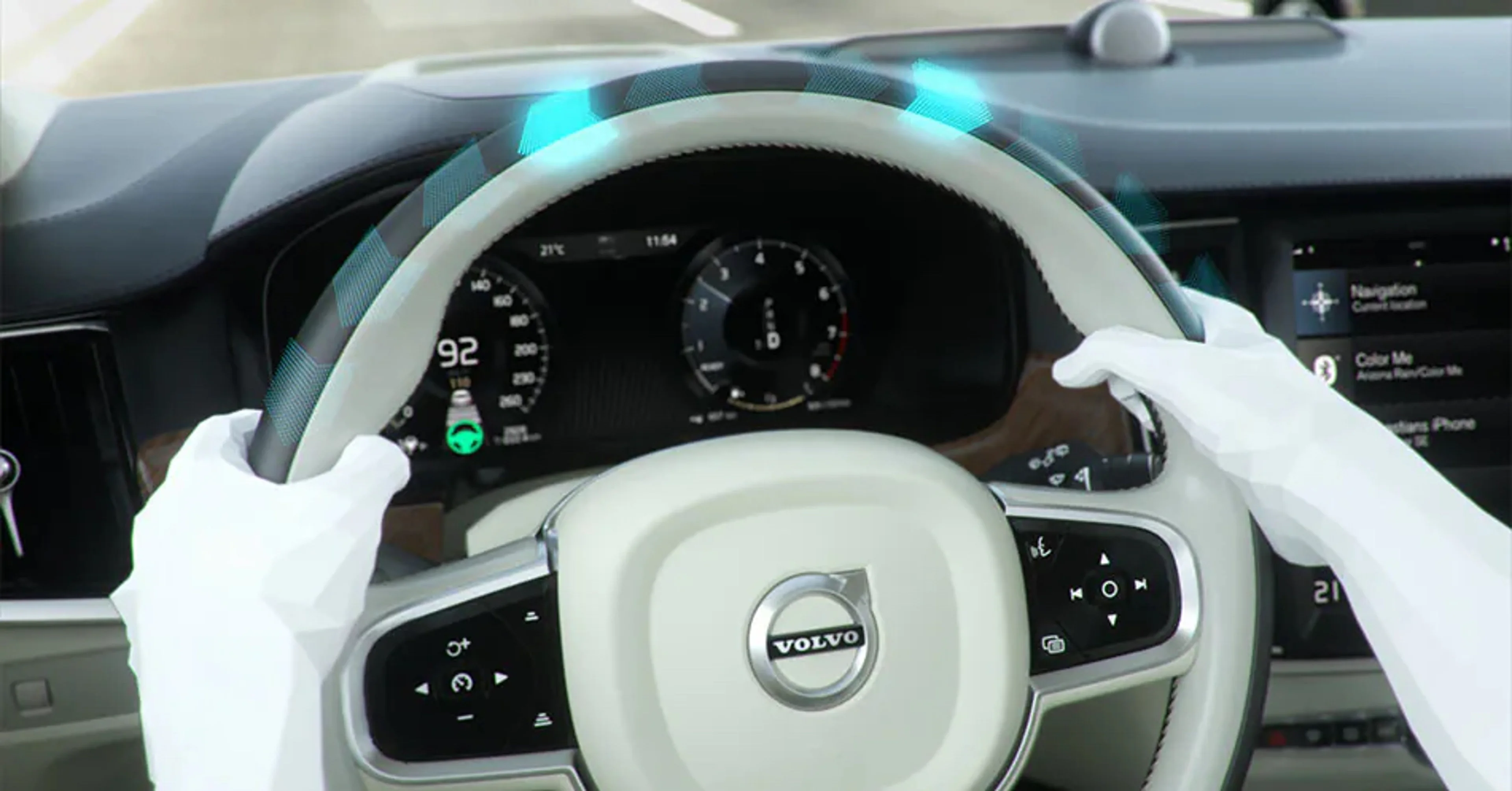 rendered image of hands on steering wheel