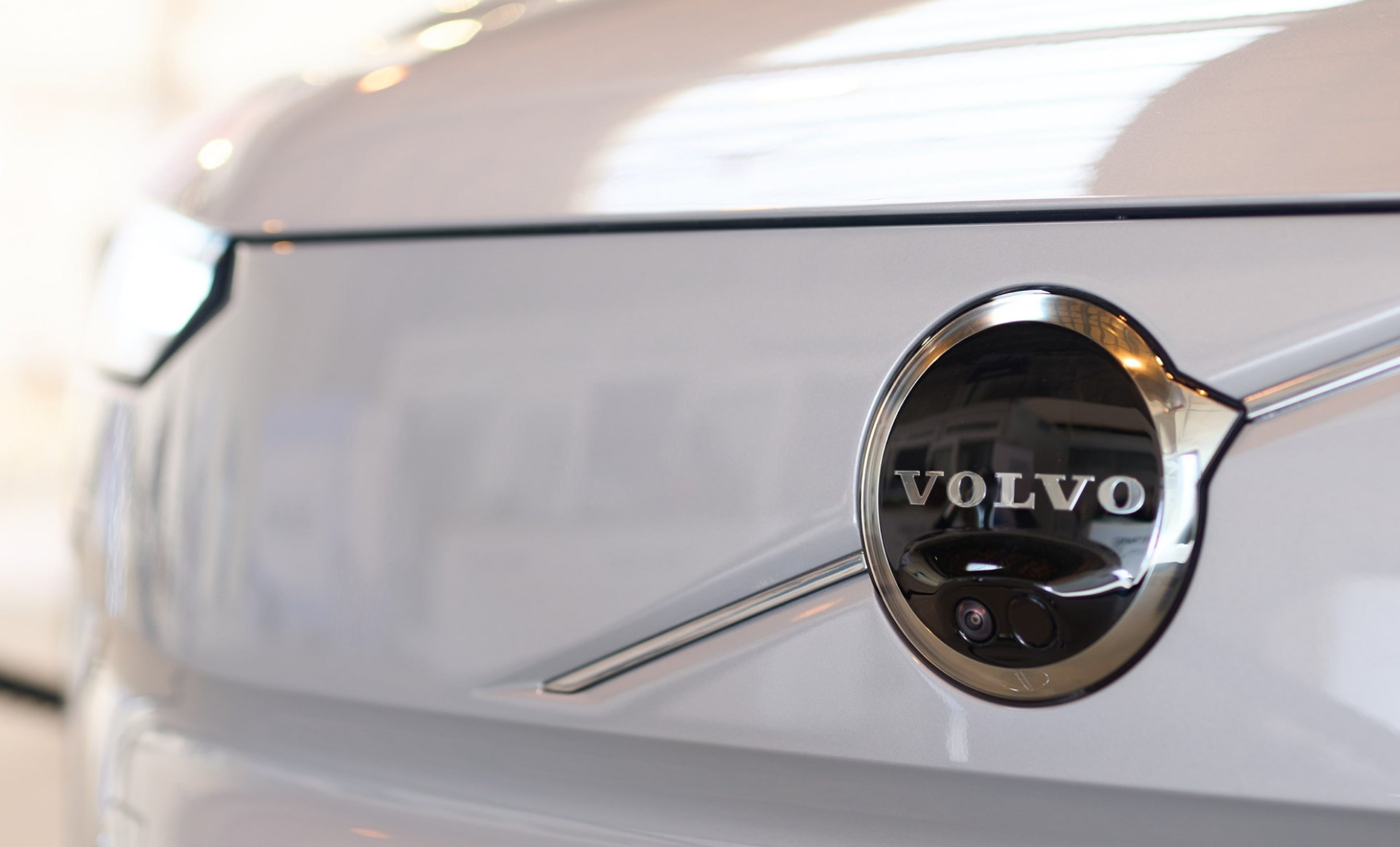 A close up view of a Volvo logo on Volvo EX30