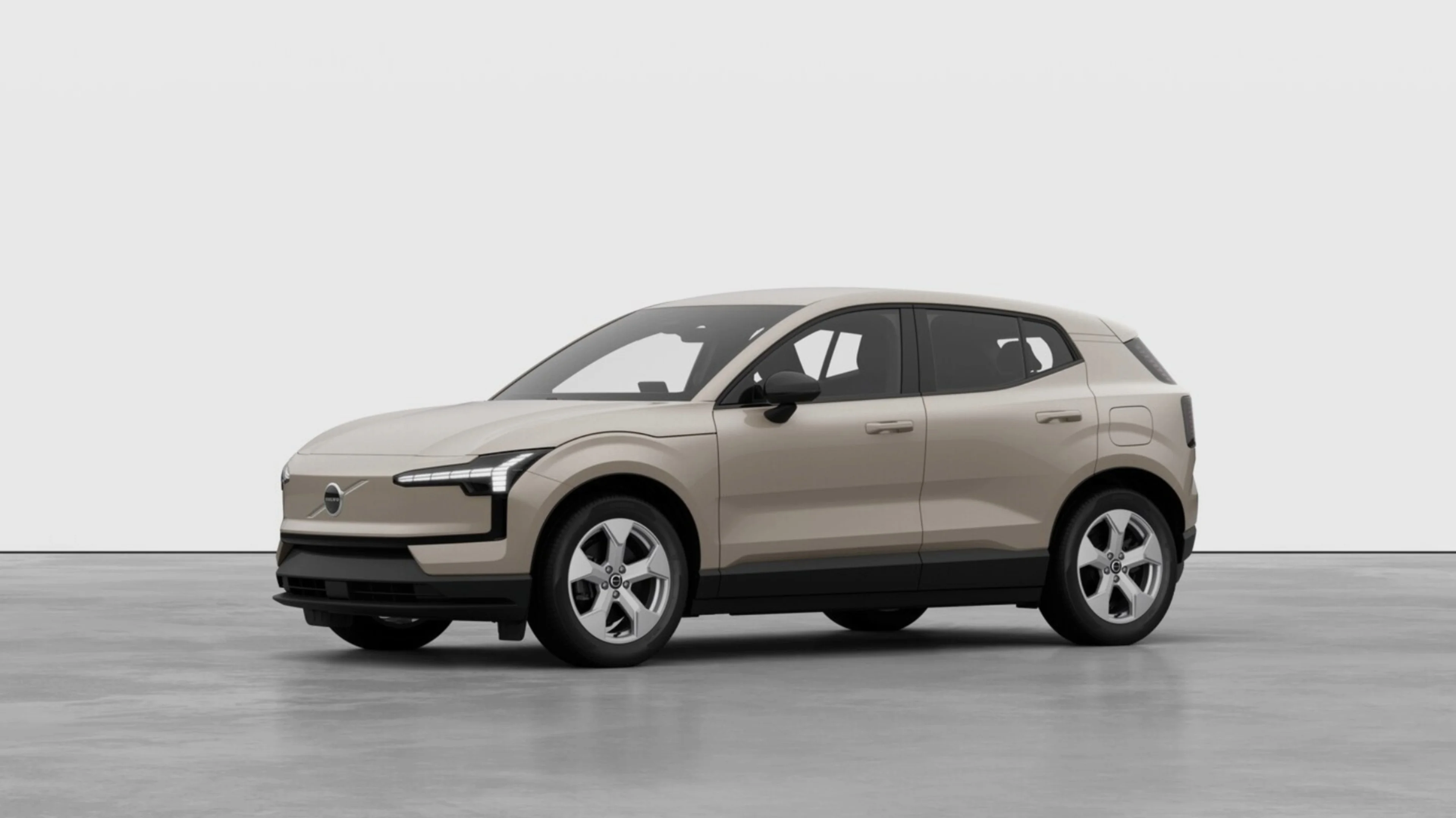Novo Volvo EX30 Essential 14 EX30 sand dune num estúdio branco