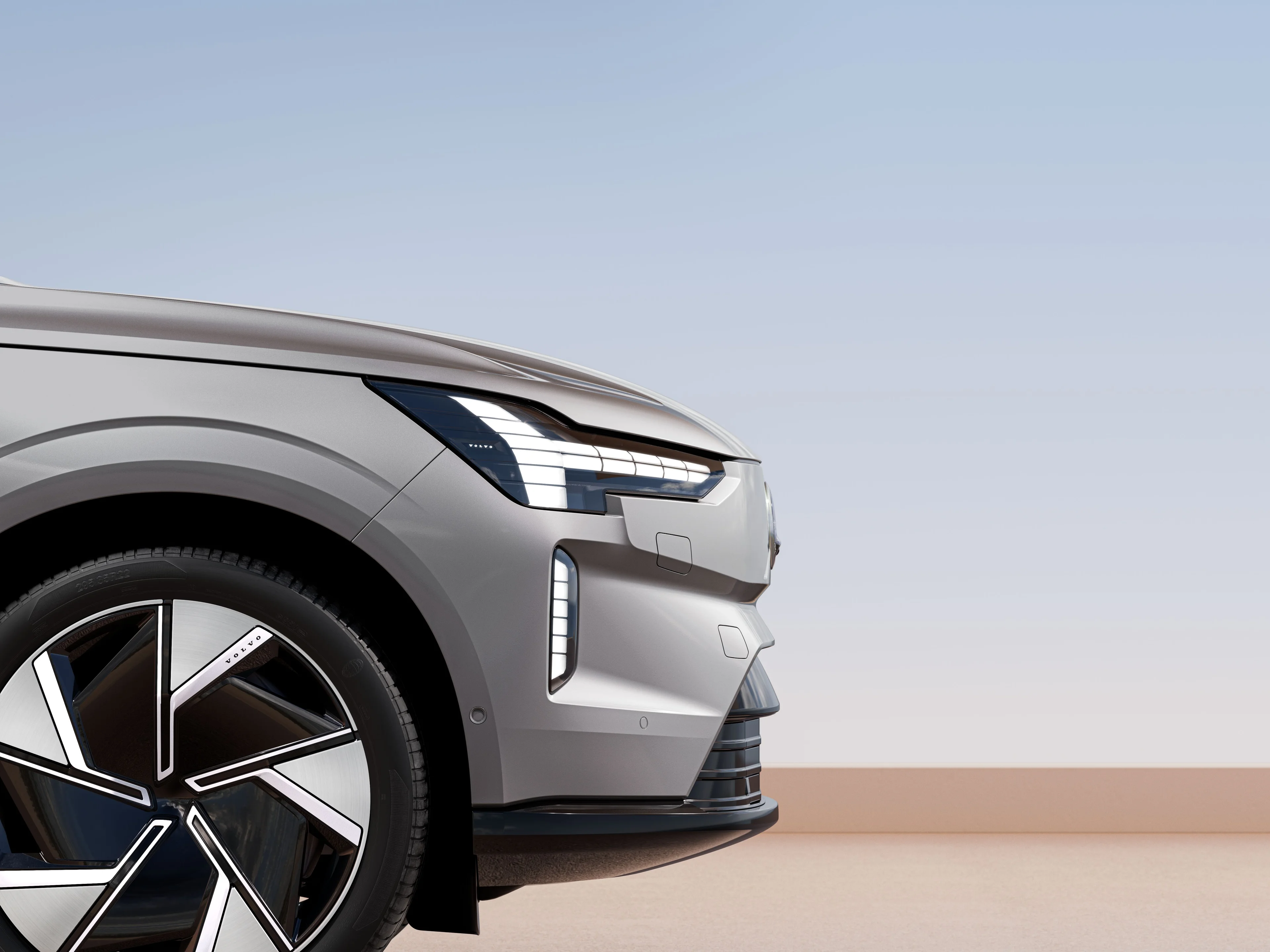 베이퍼 그레이 Volvo EX90 car의 부분적인 측면도