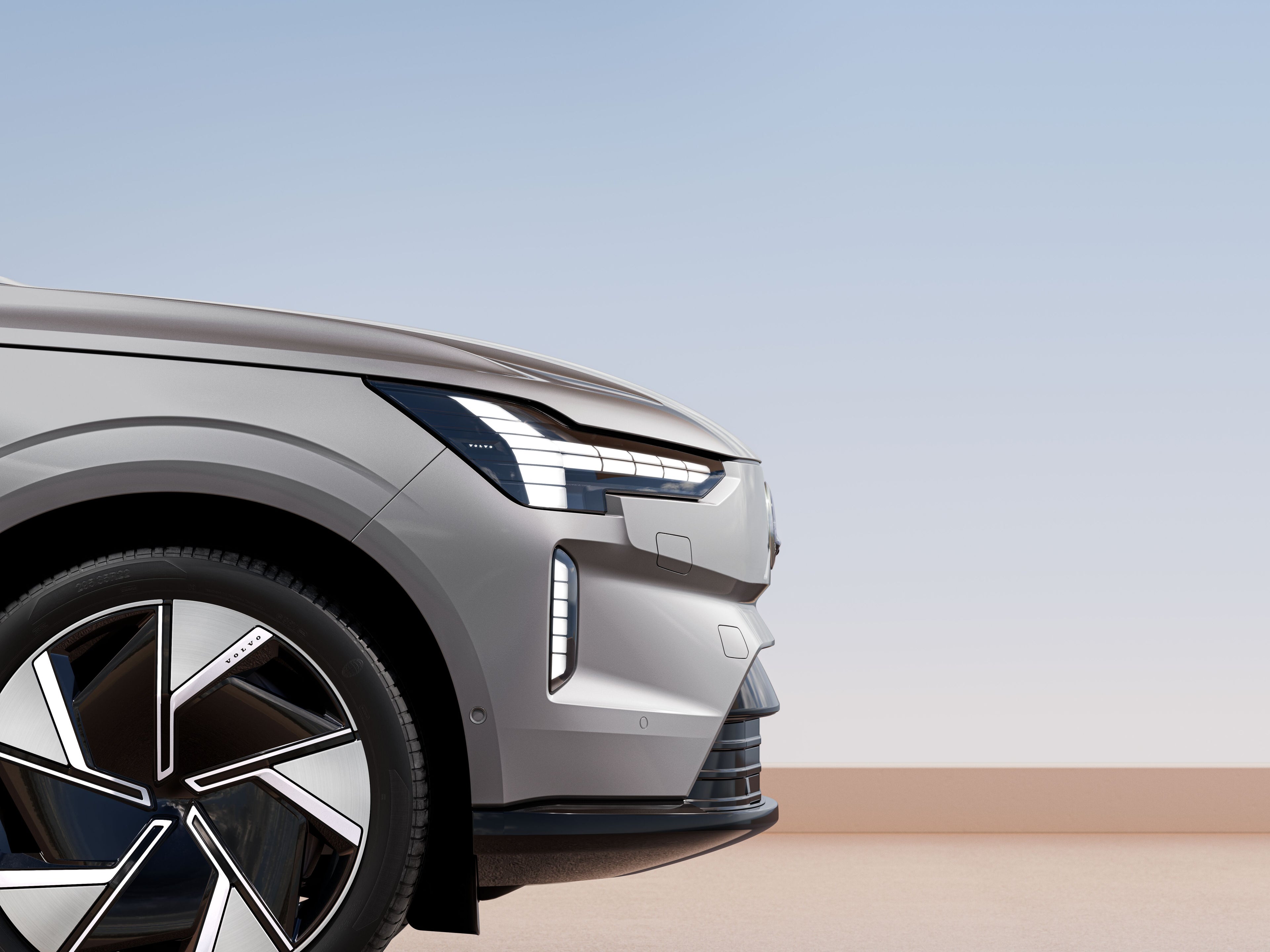Uma visão parcial lateral de um carro Volvo EX90 Vapour Grey
