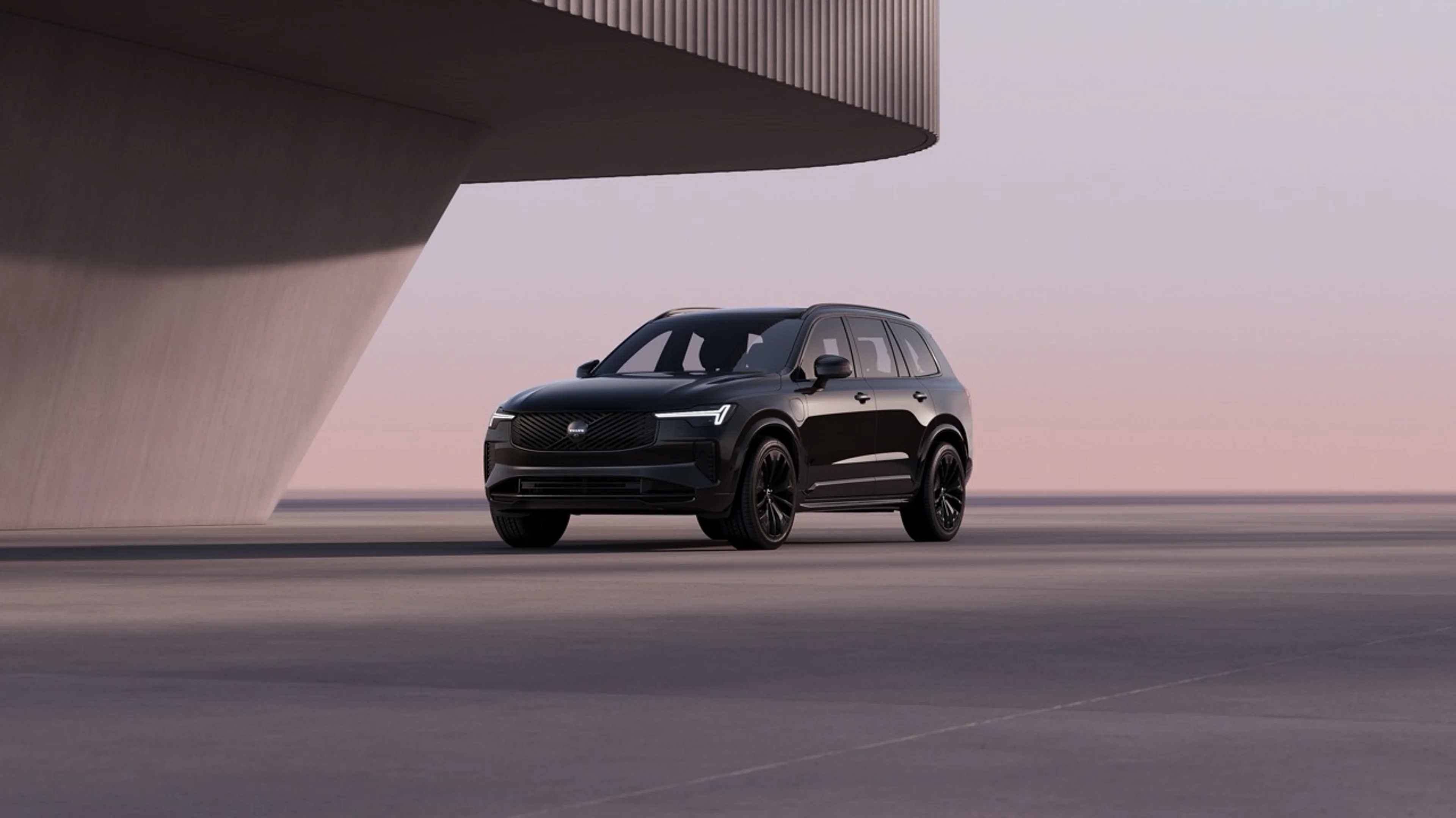 An all black Black Edition XC90 parked at sunset.