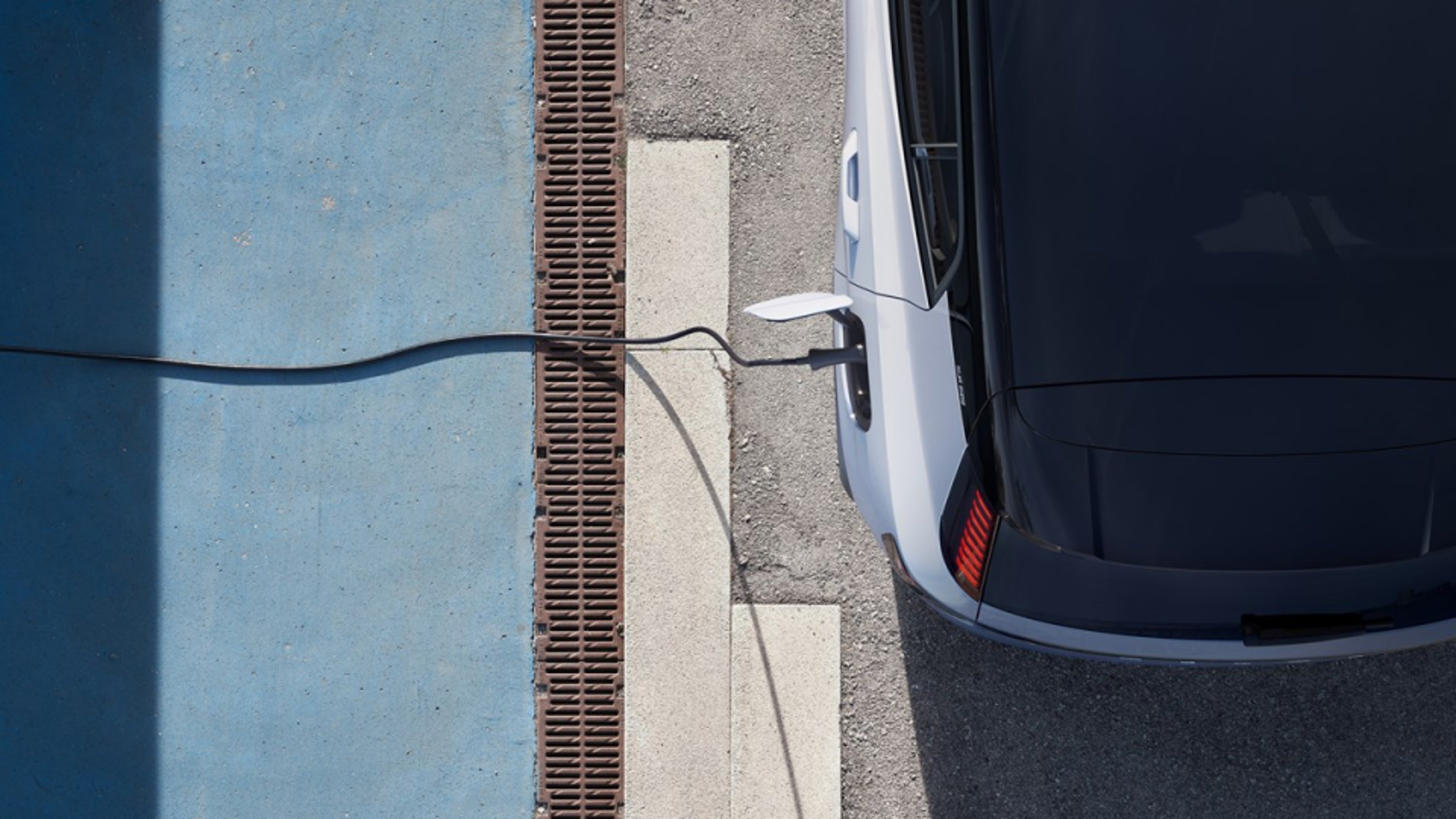 Top partial view of a charging Volvo car