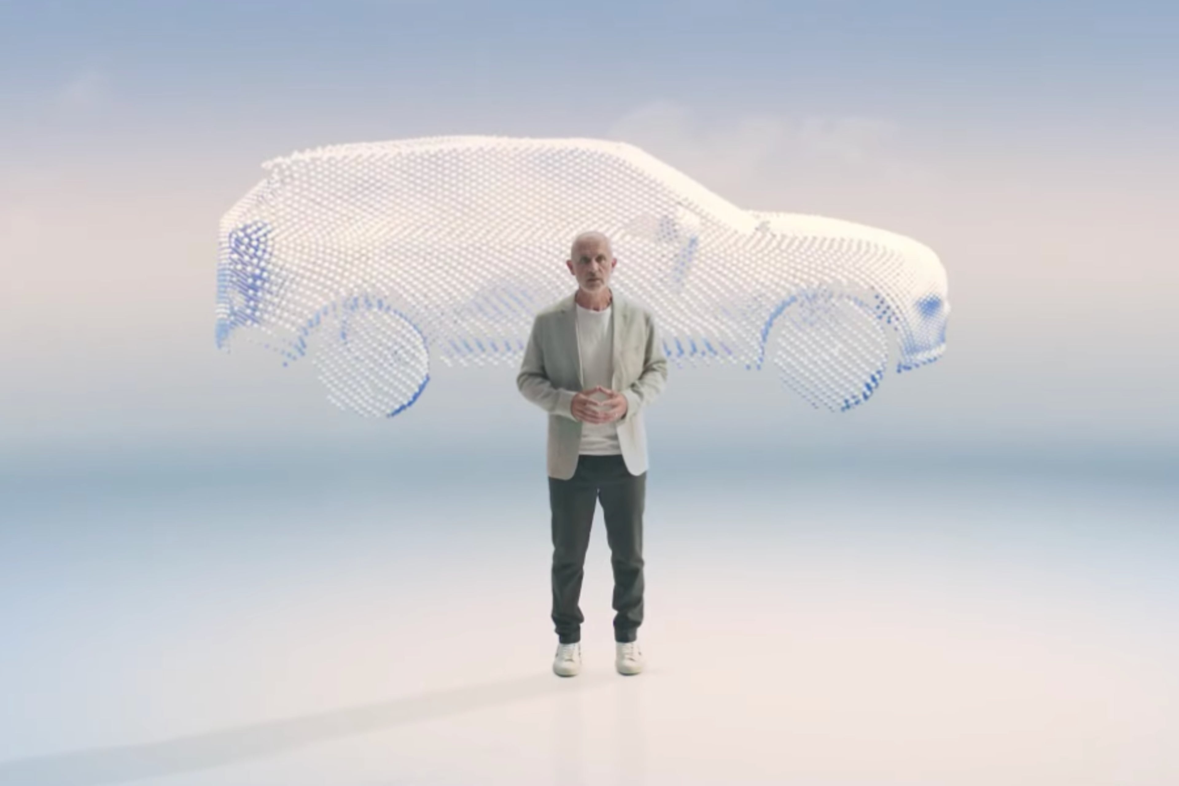 Person standing in front of a translucent floating car