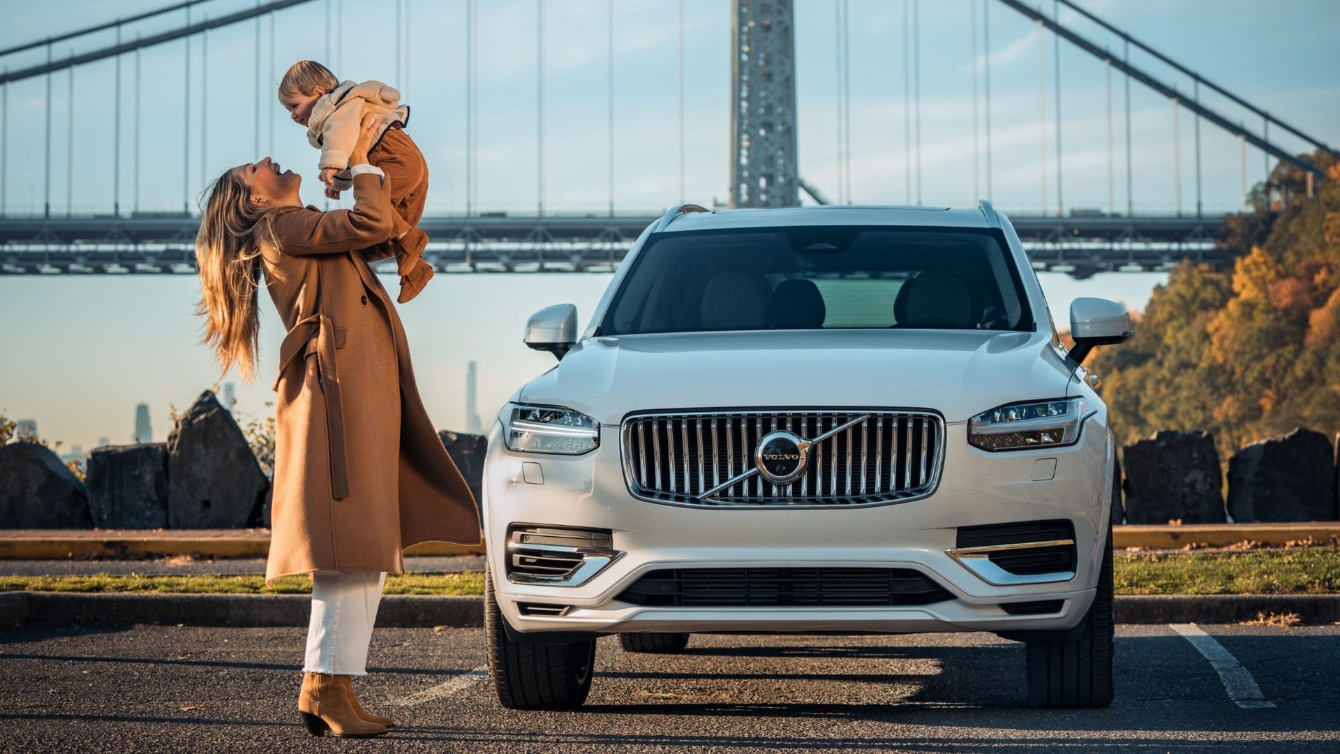 Volvo car parked in front of bridge
