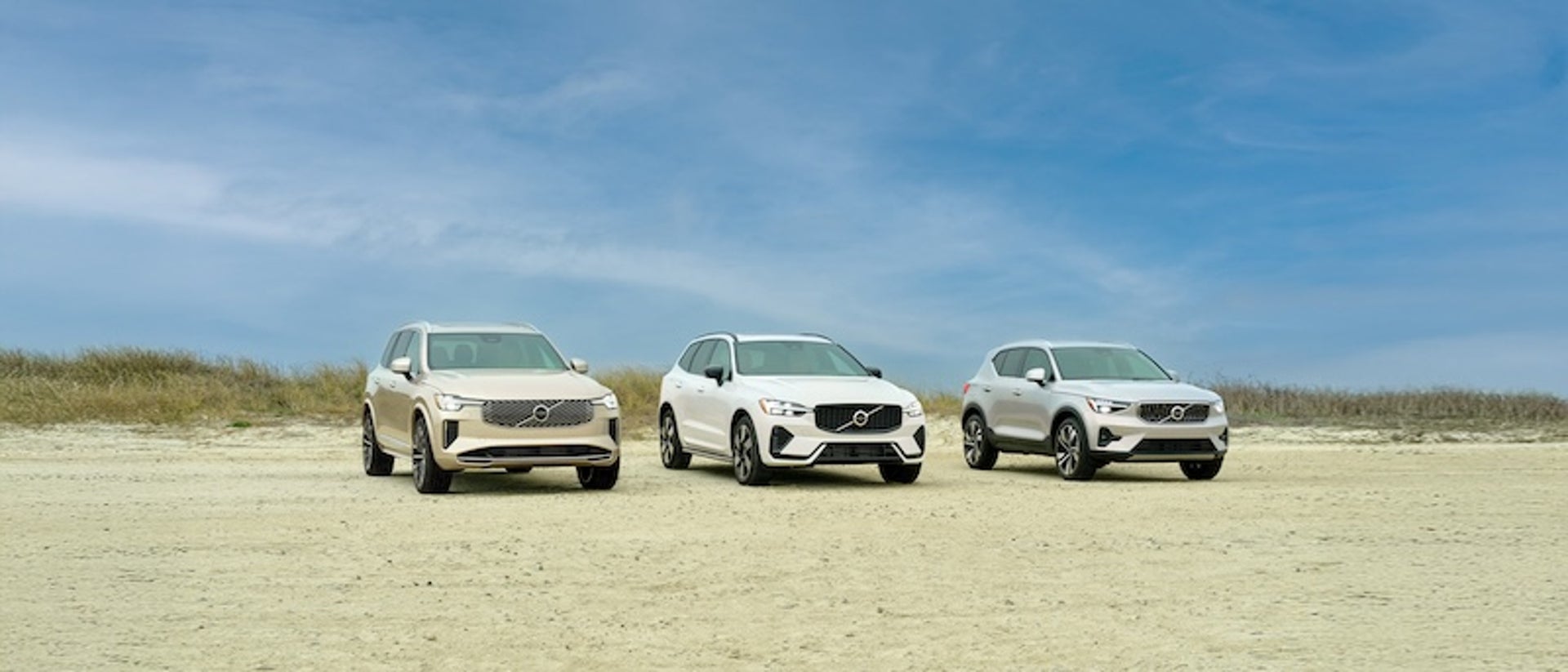 Volvo XC90, XC60 and XC40 parked on the sand