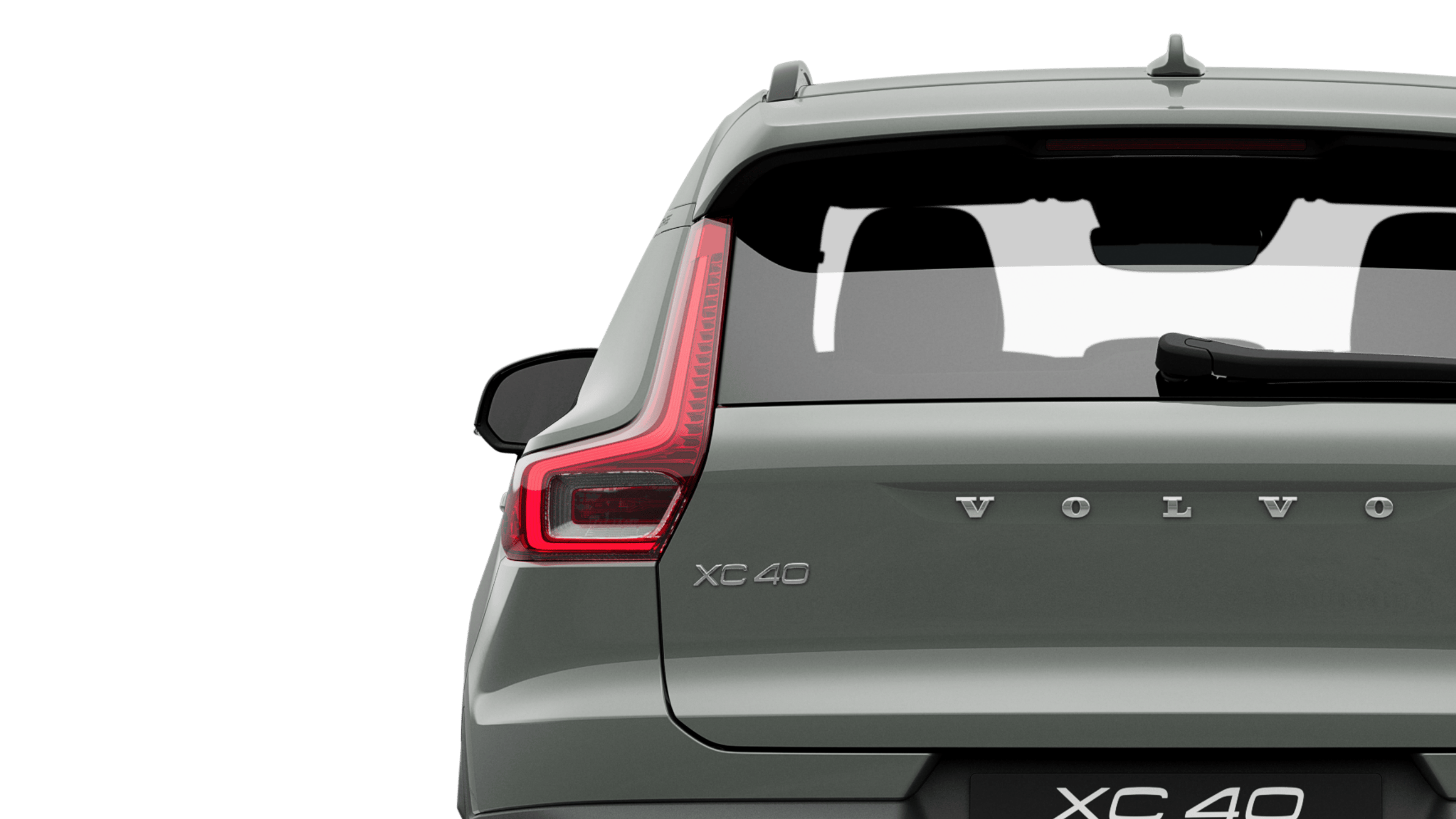 A sage green pure electric Volvo XC40 Recharge standing still