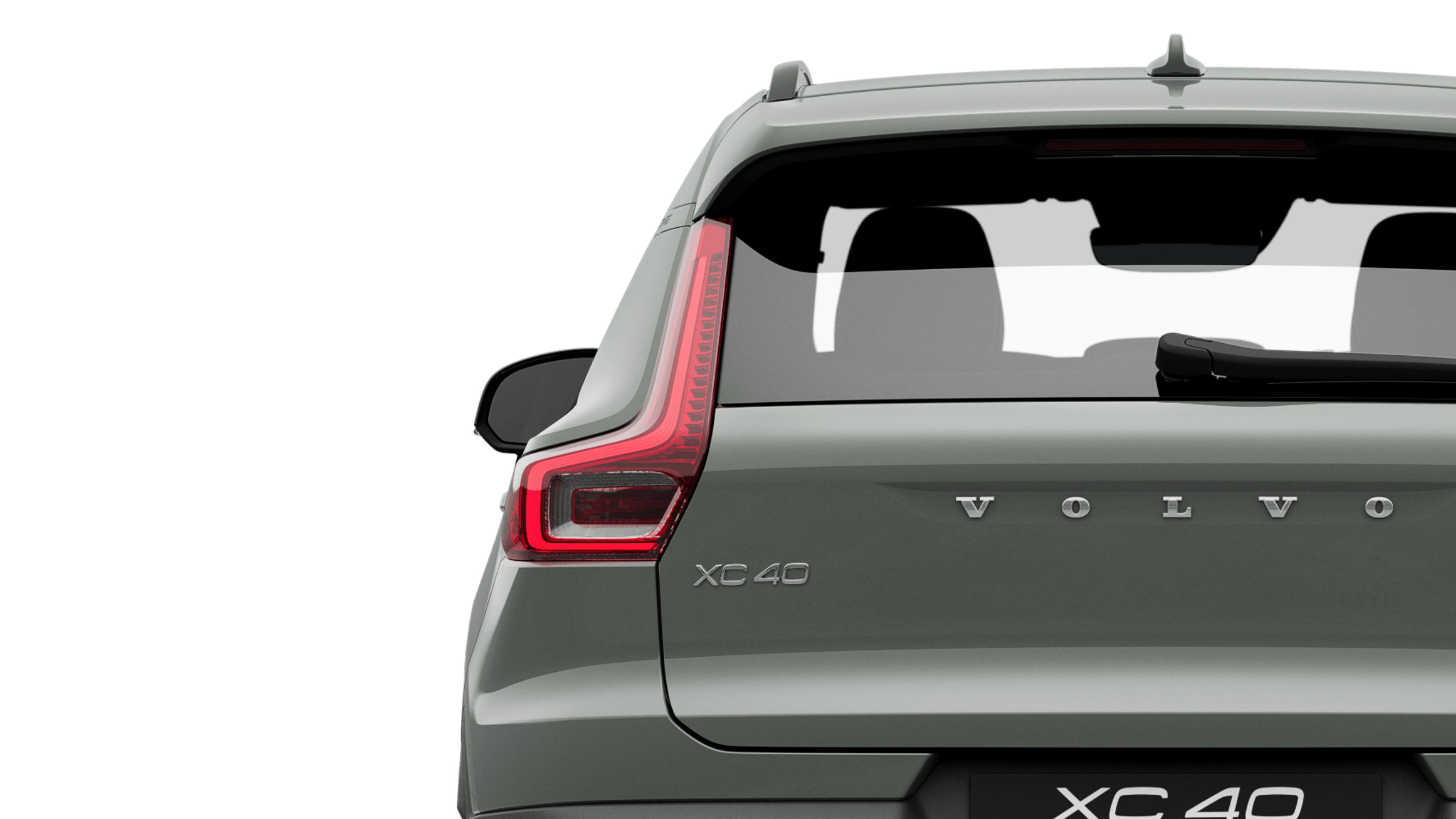 A sage green pure electric Volvo XC40 Recharge standing still