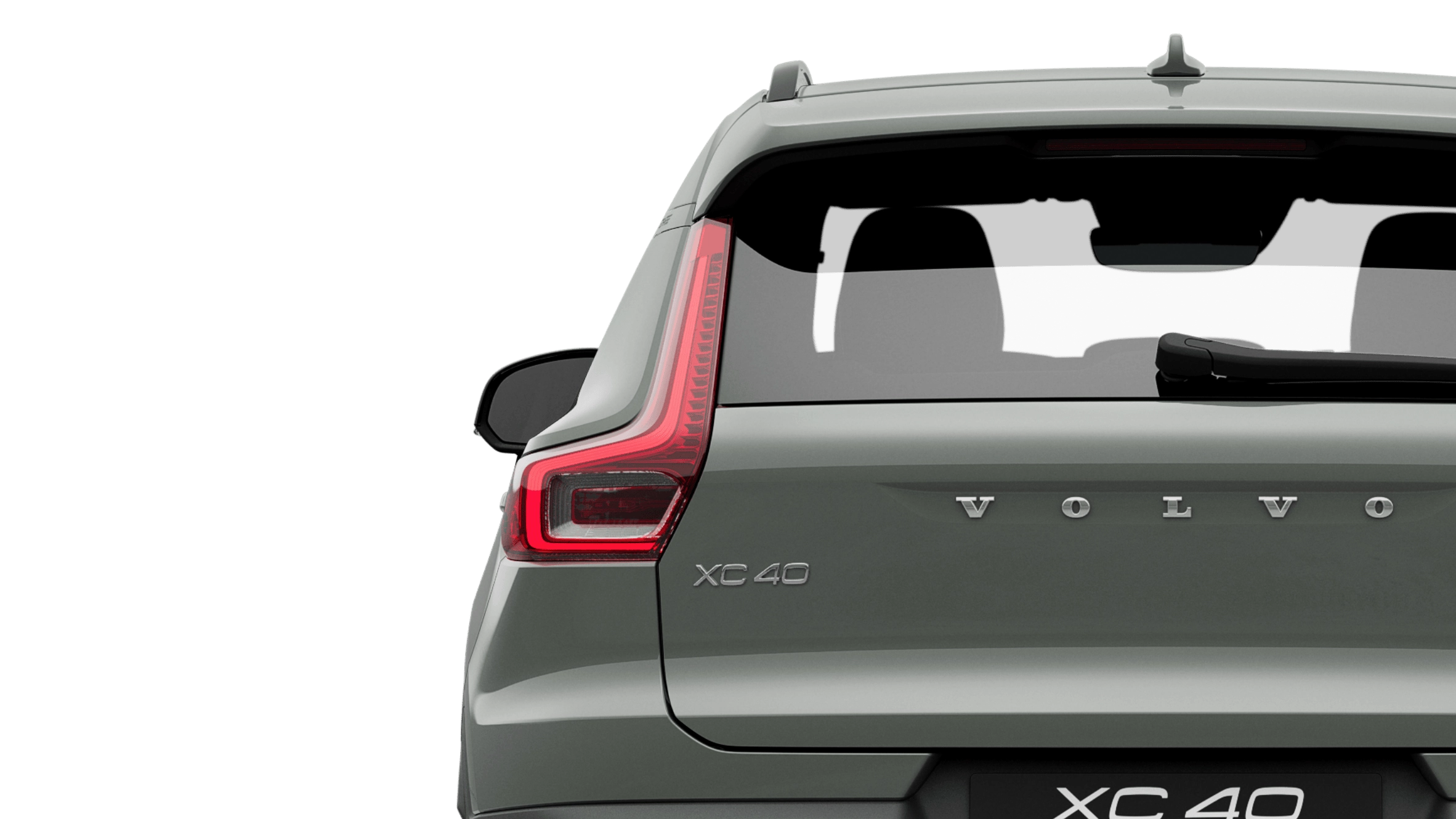 A sage green fully electric Volvo XC40 Recharge standing still