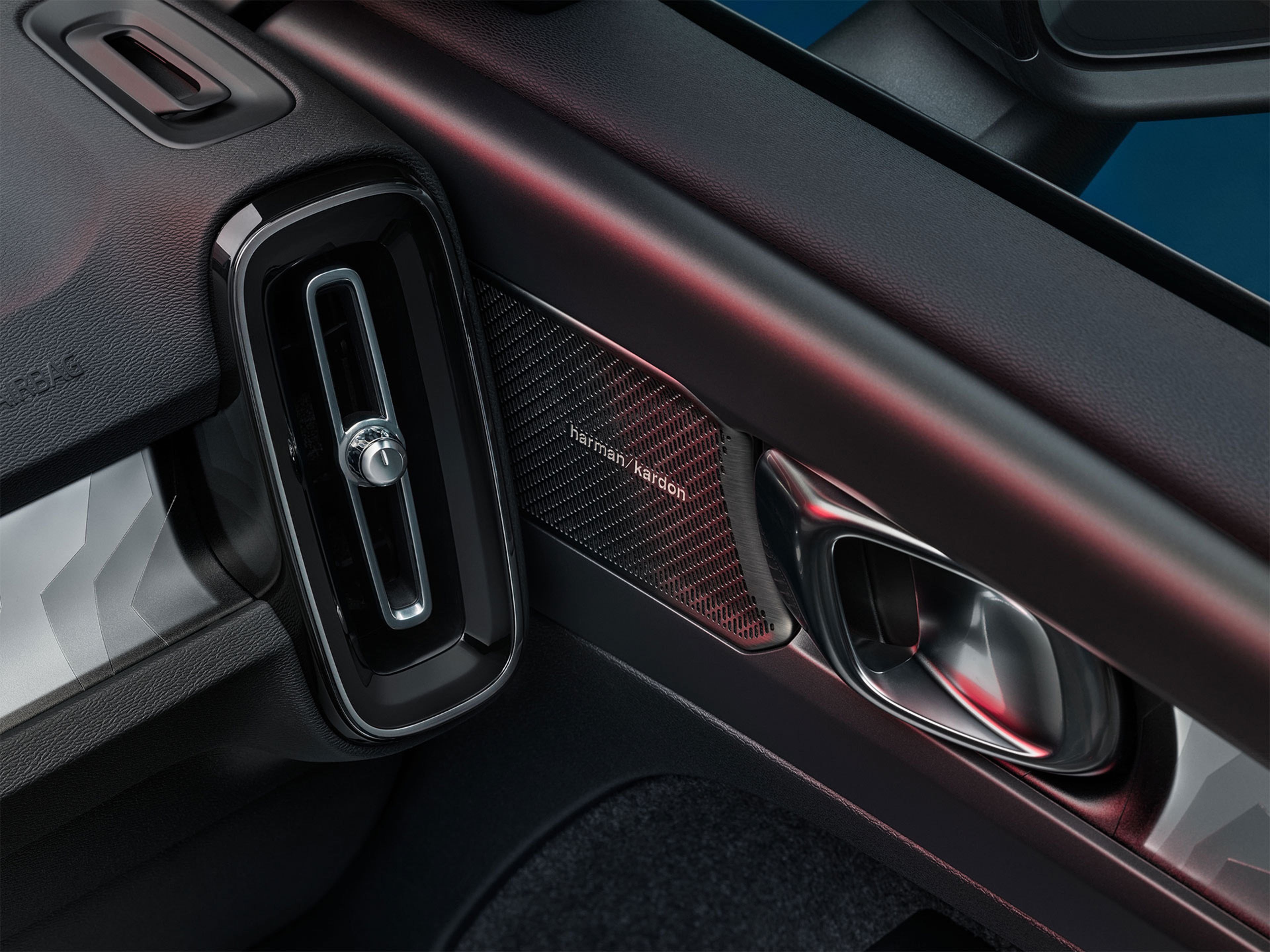 Close-up of a Harmon Kardon speaker from the inside of a Volvo