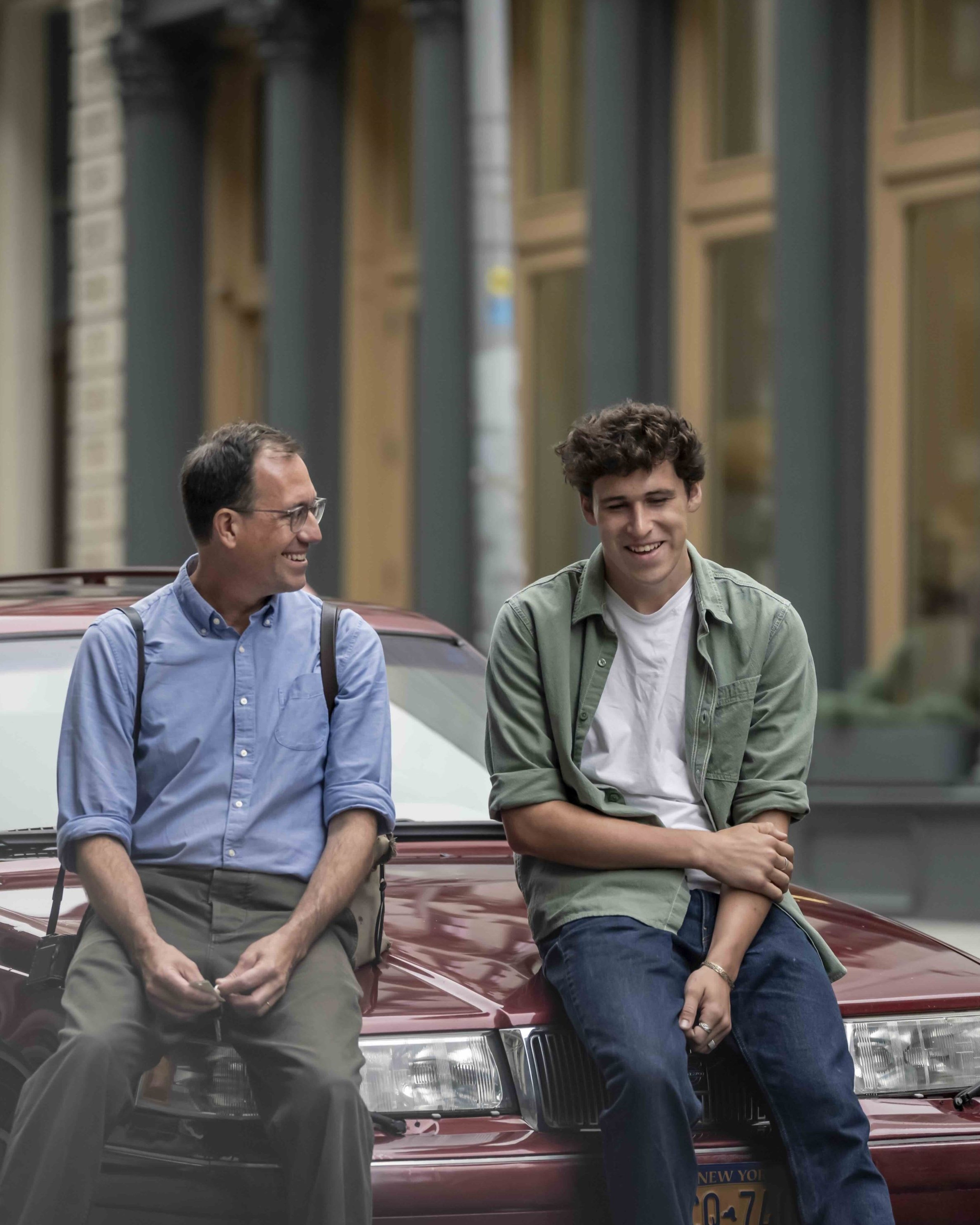 Volvo Stories - two men standing near classic Volvo wagon